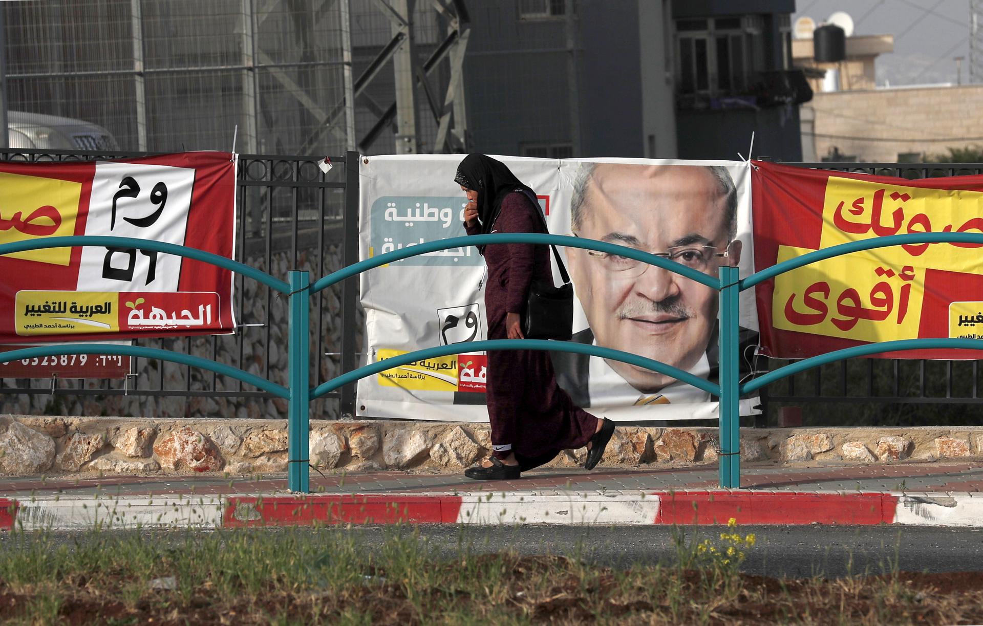 An Israeli Arab walks next to election campaign banners of the Hadash-Ta'al party in the northern Arab city of Nazareth, 07 April 2019. EFE-EPA/ATEF SAFADI/FILE