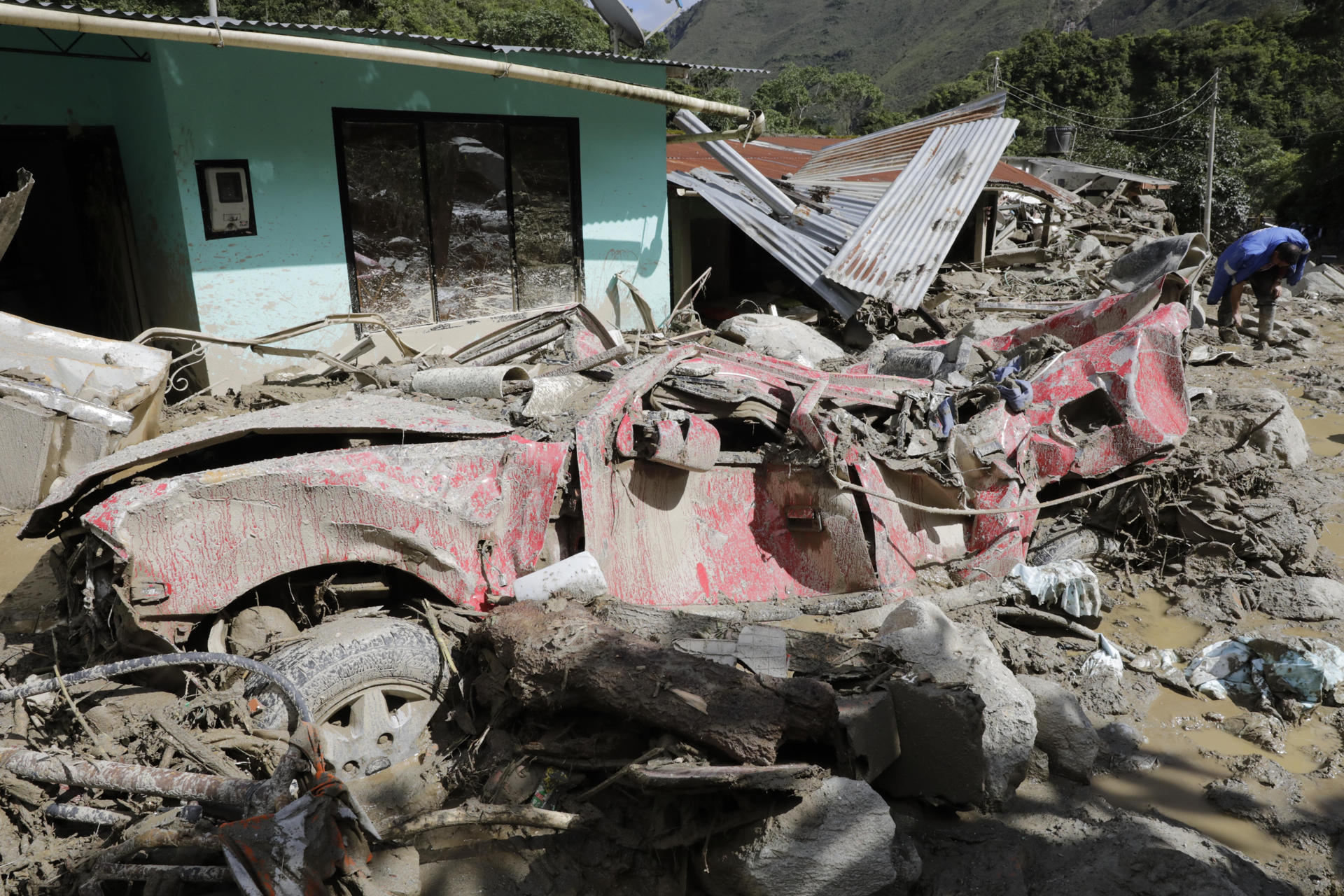 A vehicle affected by a landslide in Quetame, Cundinamarca, Colombia, 18 July 2023. EFE FILE/Carlos Ortega