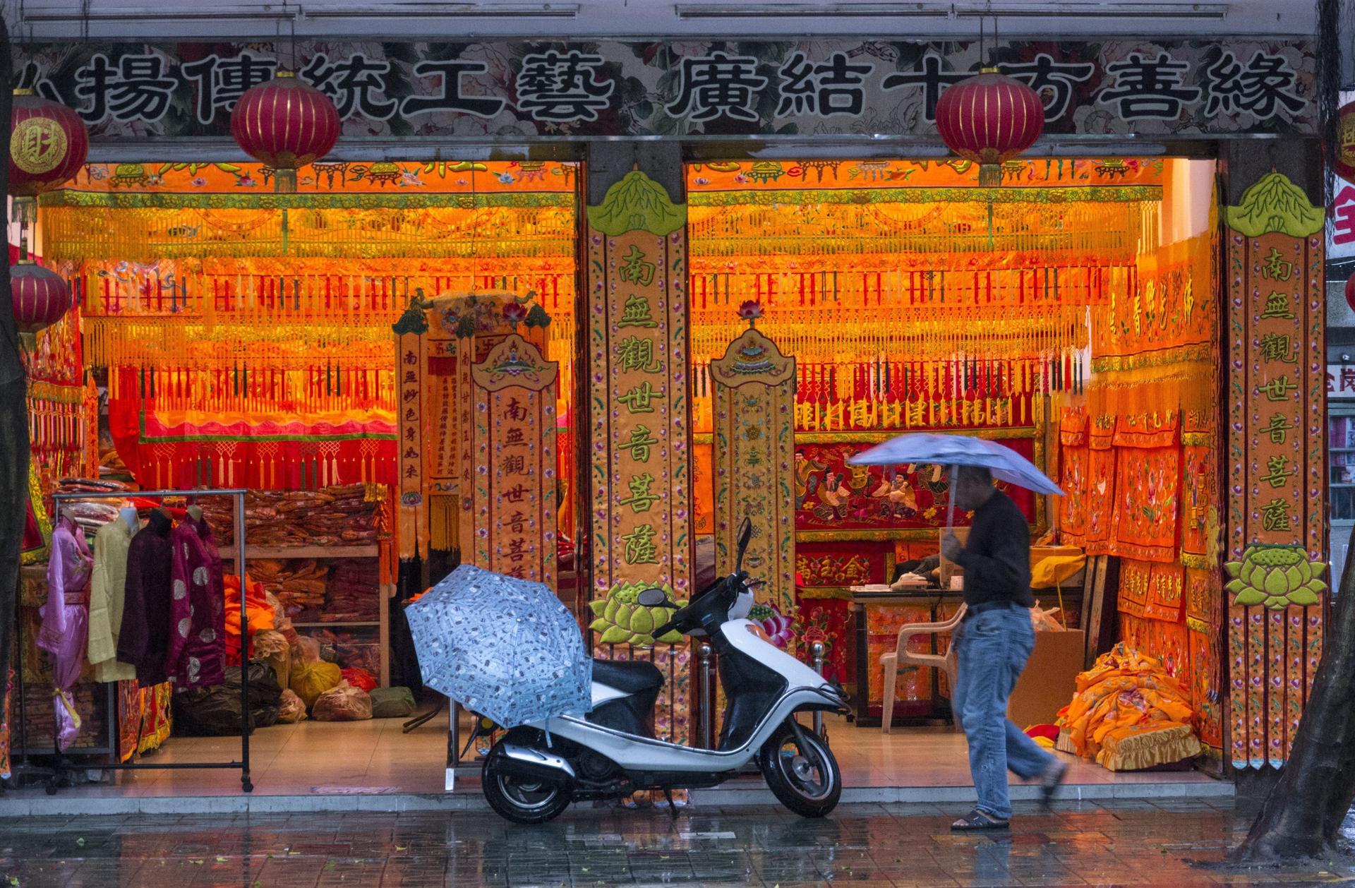 A pedestrian passes a shop specialising in embroidery in Chaozhou, Guangdong province, south China 29 November 2012. Chaozhou is home of one of EPA/ADRIAN BRADSHAW