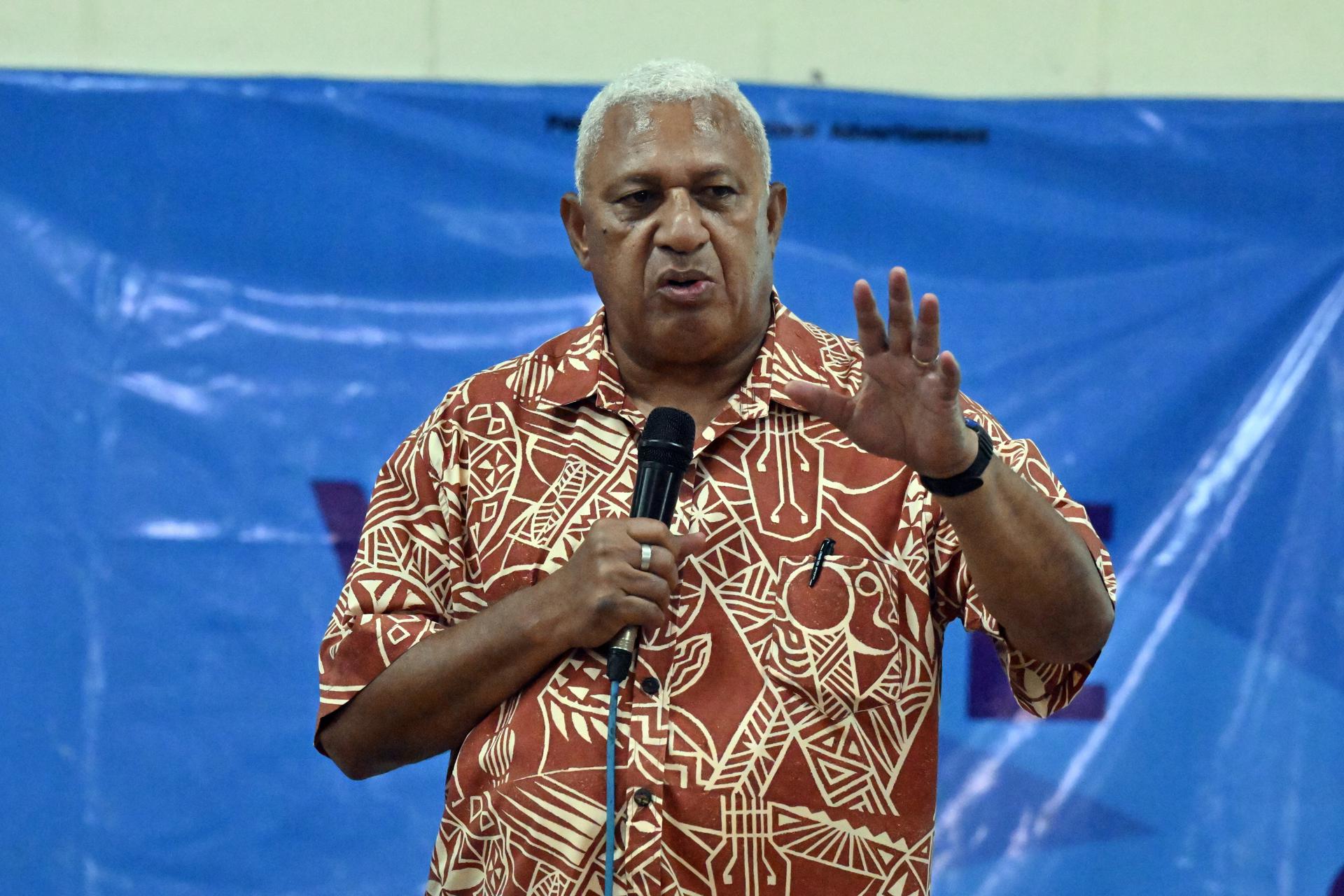 Fiji's Prime Minister and FijiFirst leader Frank Bainimarama speaks to supporters at a community hall meeting during the Fijian election campaign in Suva, Fiji, 11 December 2022. EFE-EPA FILE/MICK TSIKAS AUSTRALIA AND NEW ZEALAND OUT