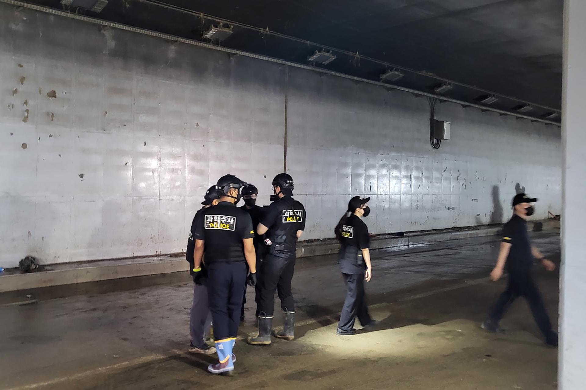 Police investigators examine an underground roadway in the town of Osong, Cheongju, South Korea, 20 July 2023. EFE/EPA/YONHAP SOUTH KOREA OUT
