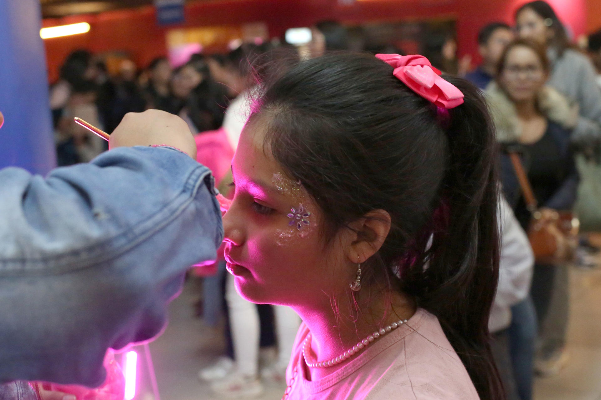 A girl getting make up put during the premiere of the movie Barbie in La Paz, Bolivia on 20 July 2023. EFE-EPA/Luis Gandarillas

