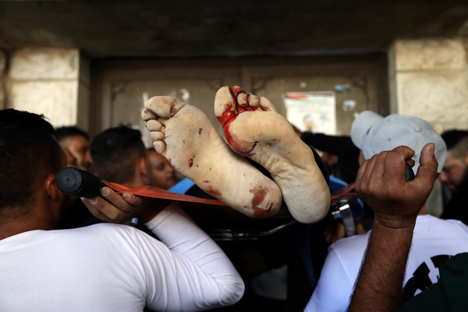 Palestinians carry the body of one of two men killed during an Israeli raid in the Old city of Nablus, northern West Bank, 07 July 2023. EFE-EPA/ALAA BADARNEH