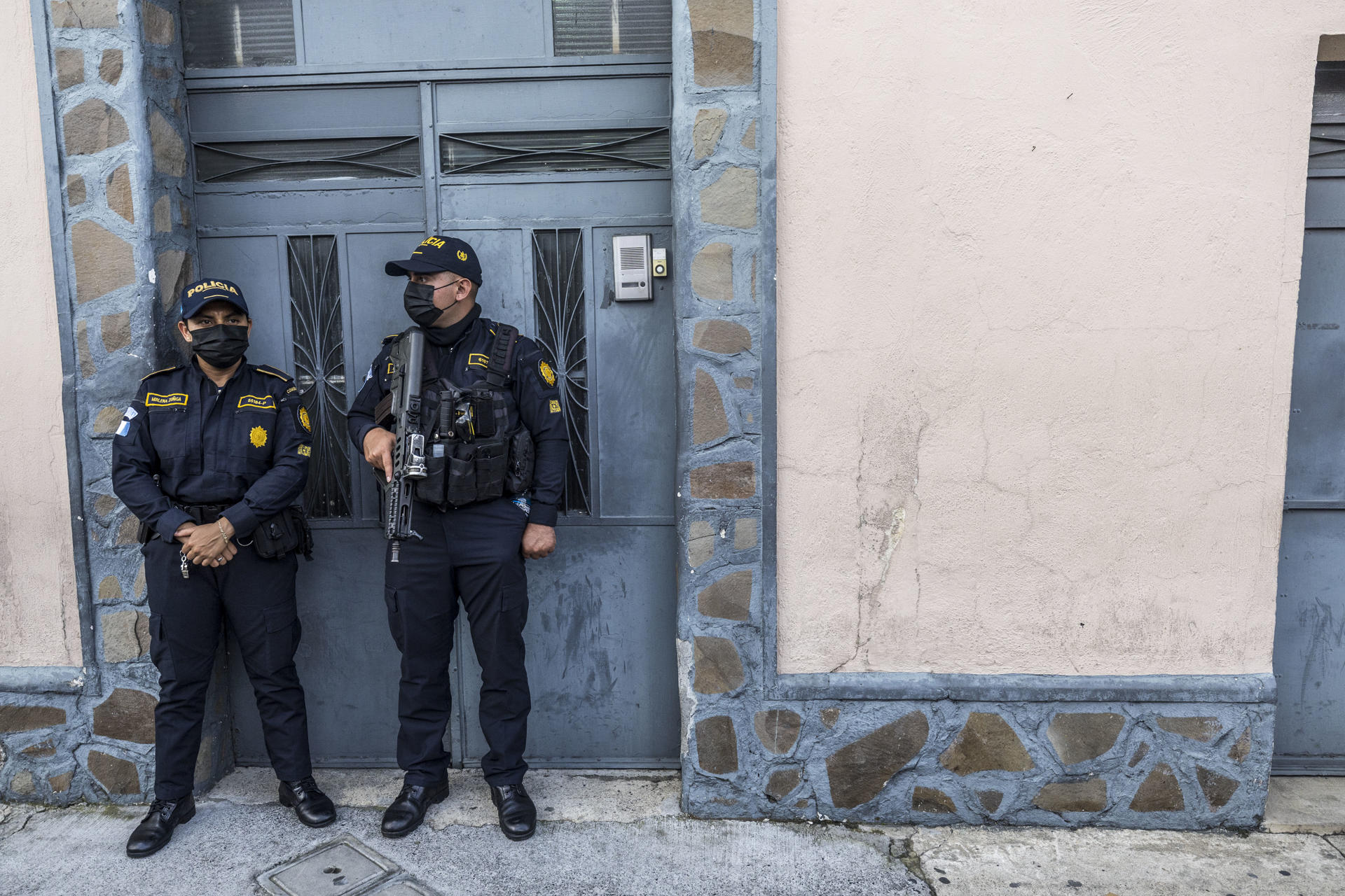 Agents of the Guatemalan Attorney General's Office stand guard during a search of the seat of the Supreme Electoral Court in Guatemala City on 20 July 2023. EFE/Esteban Biba