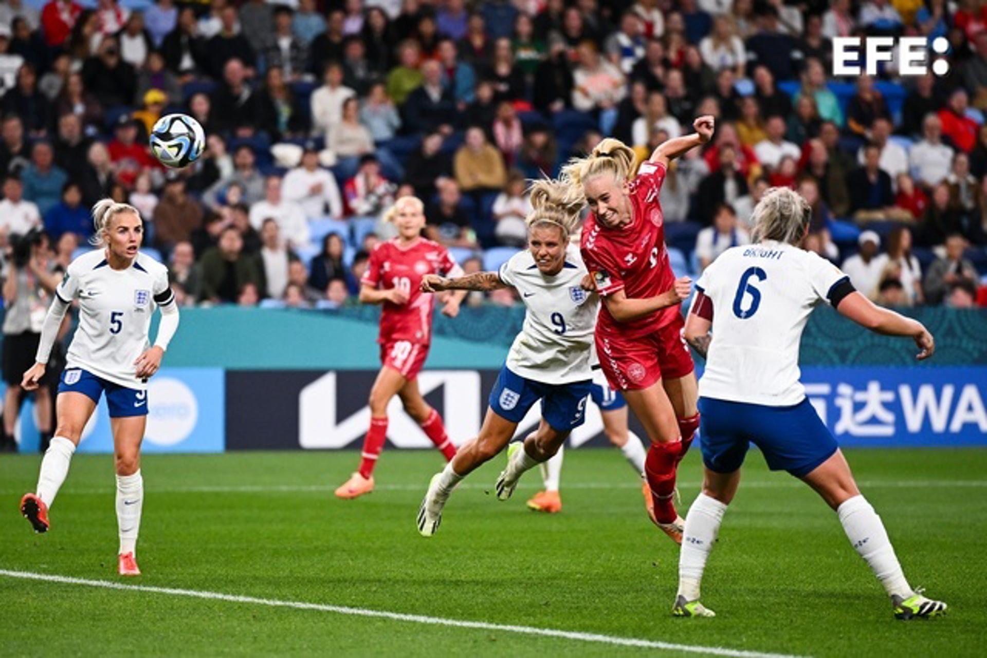 Denmark's Amalie Vangsgaard (R in red) heads the ball toward the England goal during the FIFA Women's World Cup 2023 match in Sydney. EFE/EPA/DAN HIMBRECHTS AUSTRALIA AND NEW ZEALAND OUT EDITORIAL USE ONLY