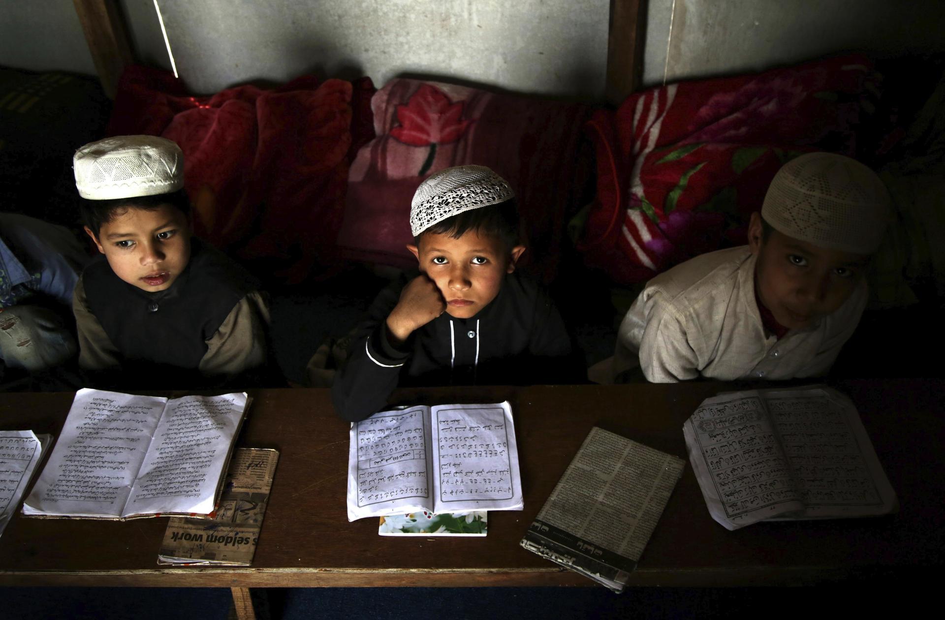 Rohingya Muslim boys from Myanmar study at the Madrasa, or Muslim religious school, at a refugee camp on the outskirts of Jammu, the winter capital of Kashmir, India, 21 February 2017. EFE-EPA/FILE/JAIPAL SINGH