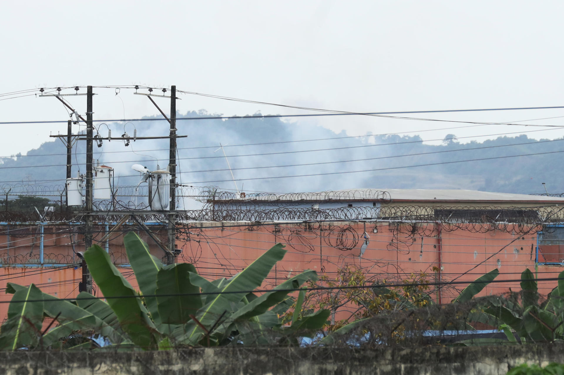 Smoke seen rising from the prison in the city of Guayaquil, Ecuador, on 23 July, 2023. EFE-EPA/Jonathan Miranda
