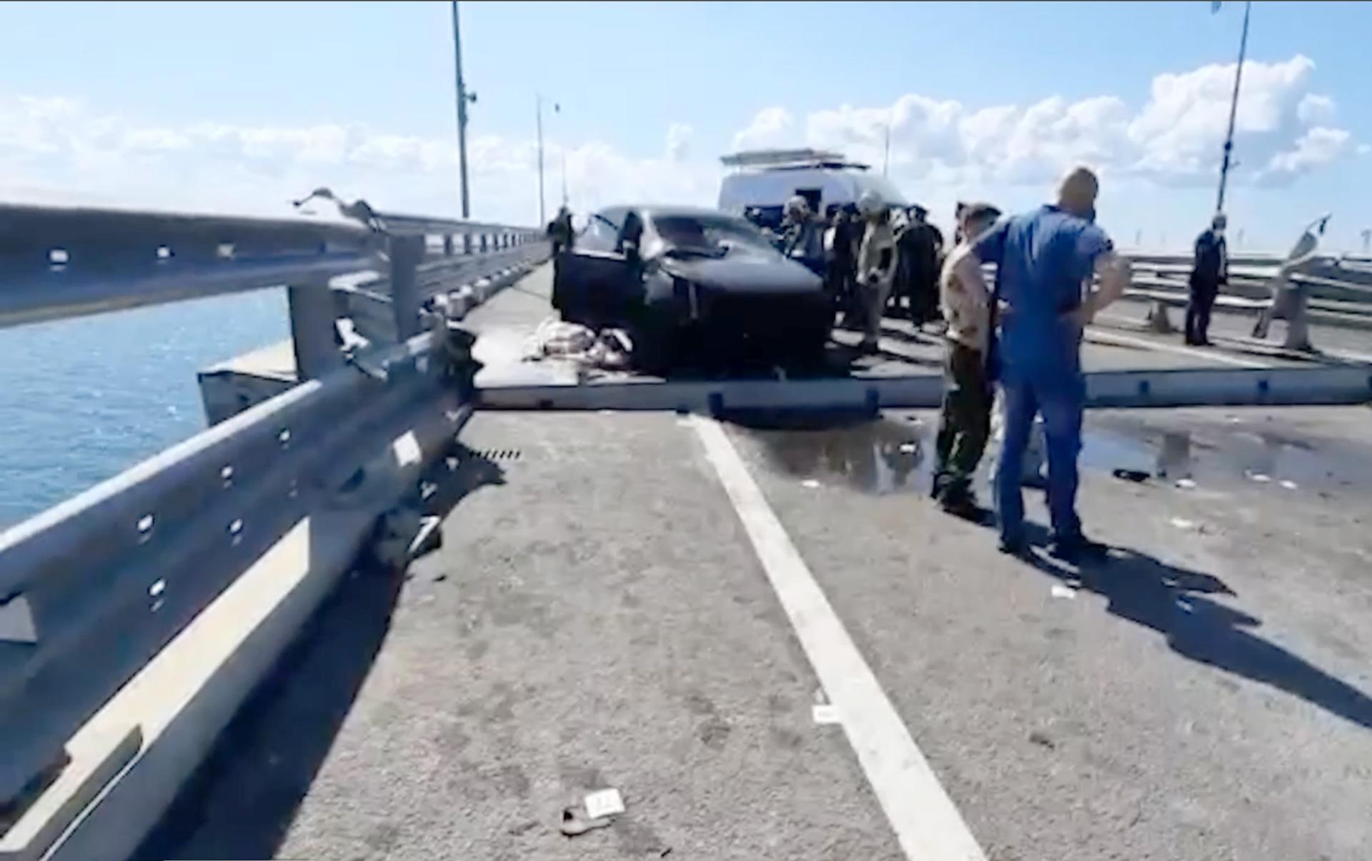 A still image taken from a handout video made available by Russia's Investigative Committee shows Russian Investigative Committee officers examining the damage on the Kerch Bridge connecting Crimea to mainland Russia, 17 July 2023. EFE-EPA/INVESTIGATIVE COMMITTEE OF THE RUSSIAN FEDERATION -- BEST QUALITY AVAILABLE -- MANDATORY CREDIT -- HANDOUT EDITORIAL USE ONLY/NO SALES
