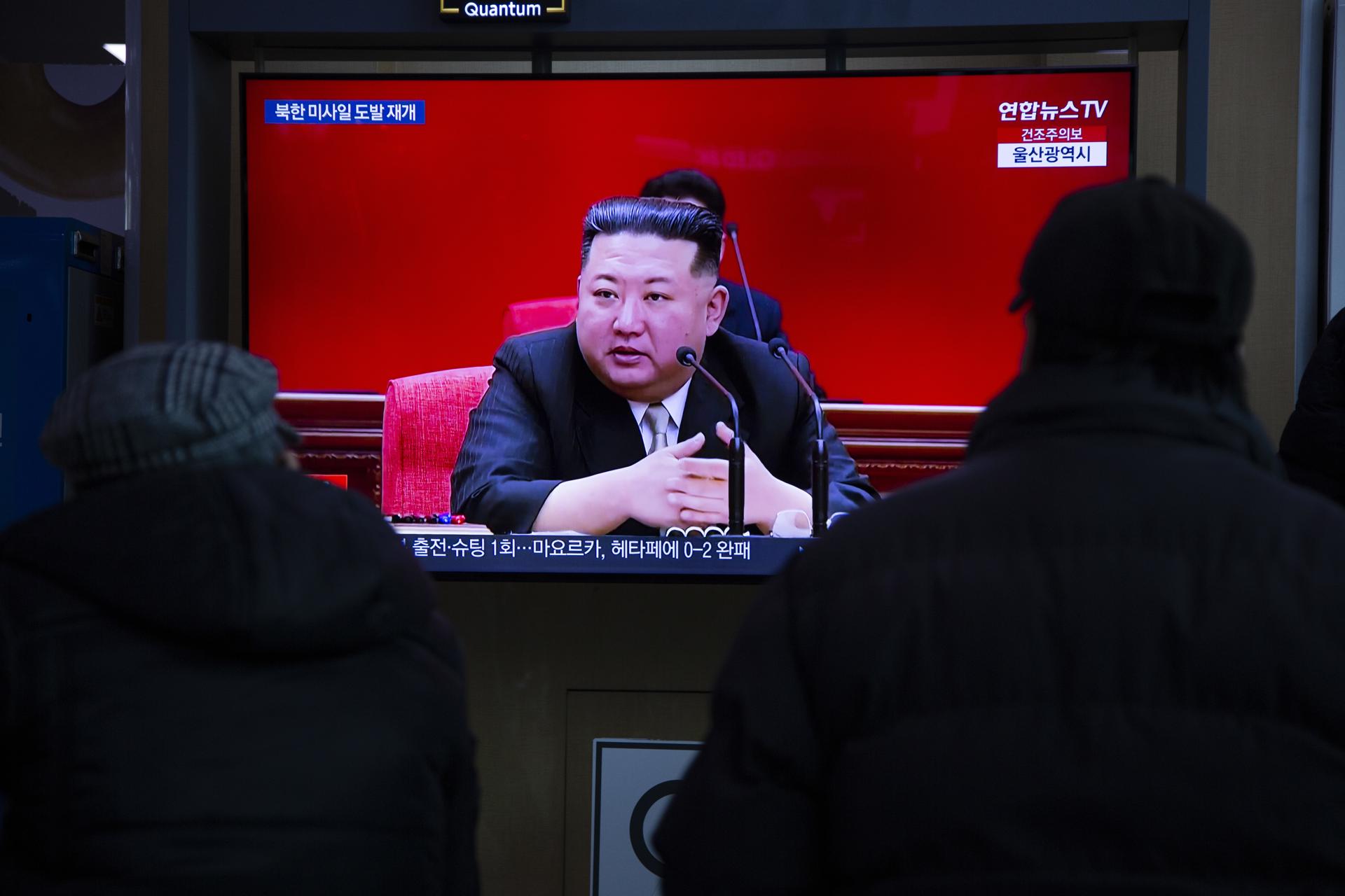 People watch North Korean leader Kim Jong-un on a tv monitor at a station in Seoul, South Korea, 31 December 2022. EFE/EPA/JEON HEON-KYUN