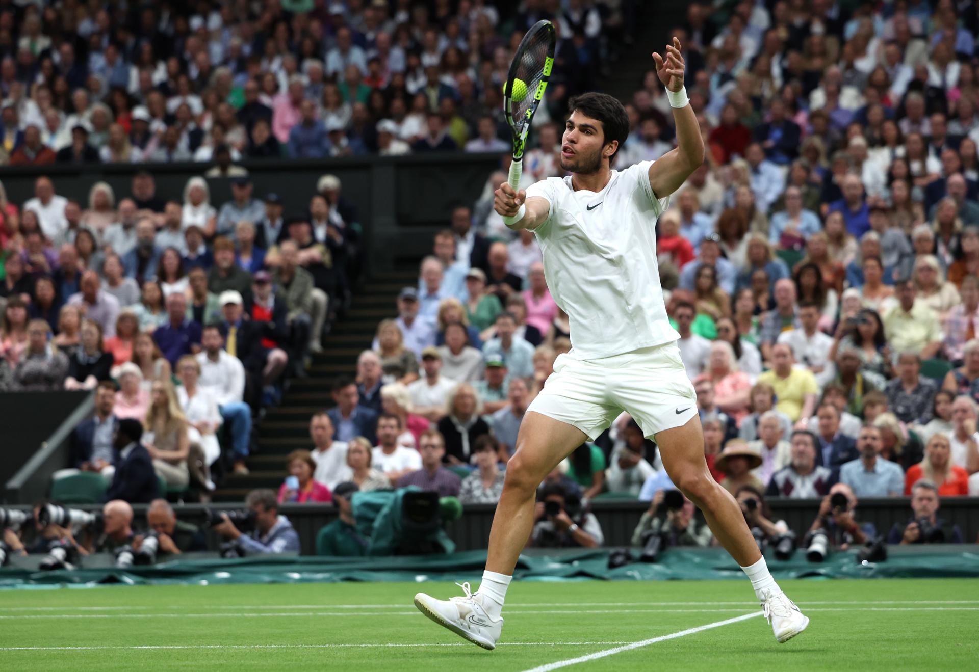 Spanish world No. 1 Carlos Alcaraz hits a backhand volley during his Wimbledon semifinal match against third-seeded Russian Daniil Medvedev on 14 July 2023 in London, United Kingdom. Alcaraz won 6-3, 6-3, 6-3. EFE/EPA/ISABEL INFANTES

