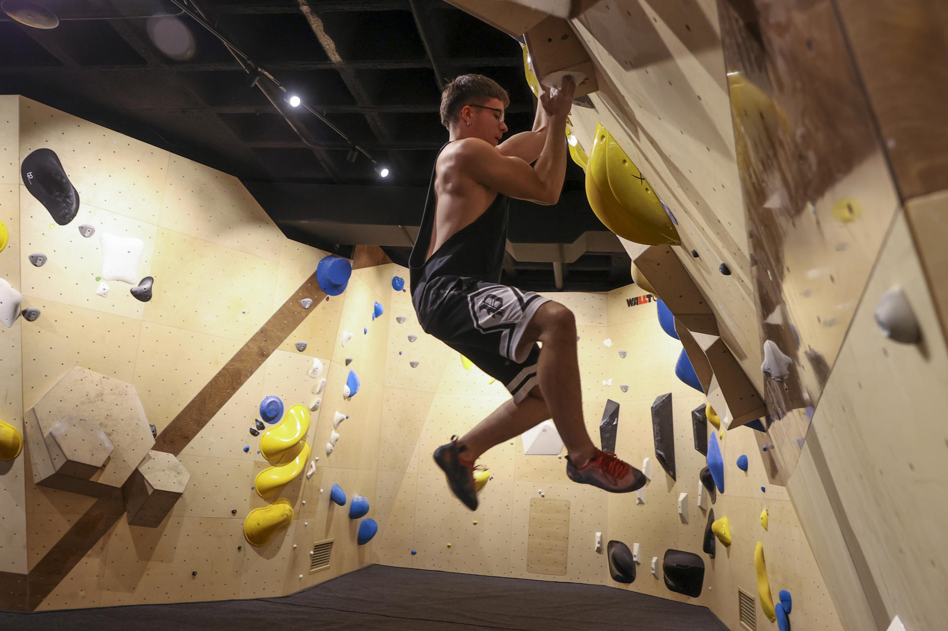A young man practices sports climbing at the vast, newly inaugurated Sputnik Climbing center in the Madrid neighborhood of Legazpi on 27 July 2023. EFE/ Kiko Huesca