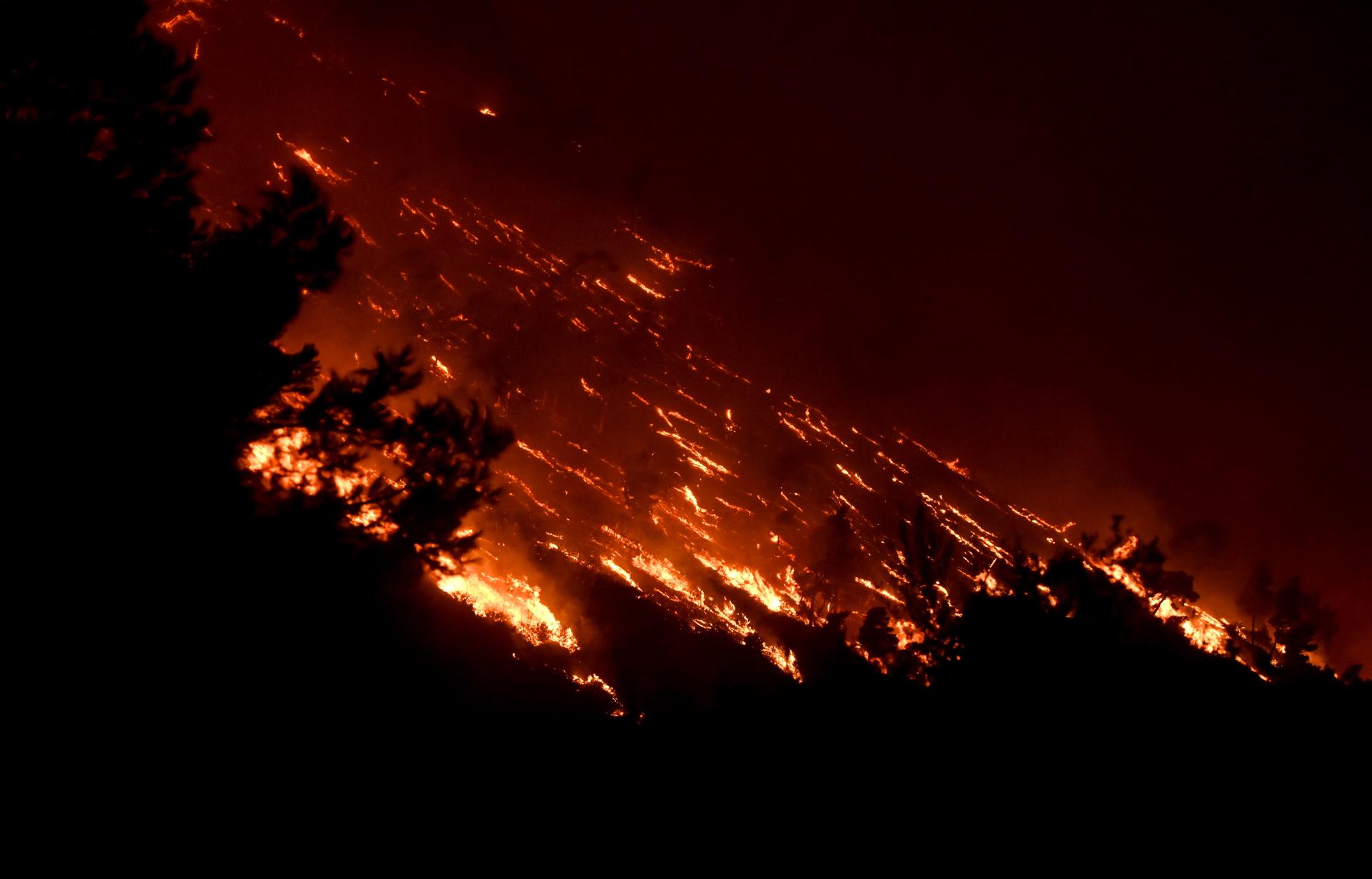A wildfire burns at the Trapeza village, in Achaia Peloponnese, Greece, 23 July 2023. EFE-EPA/GIOTA LOTSARI
