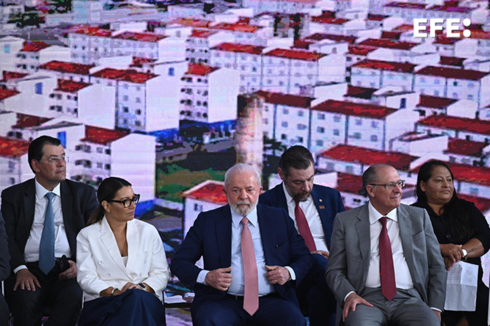 Brazilian President Luiz Inacio Lula da Silva (C) prepares to sign into law a bill to expand a subsidized-housing program in Brasilia on 13 July 2023. EFE/Andre Borges