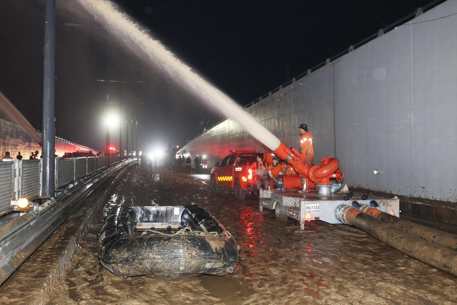 Rescue workers pump water out of a flooded underground tunnel in the town of Osong, North Chungcheong Province, central South Korea, on 17 July 2023, as they search for missing people who are believed to have been submerged inside the tunnel after a nearby river overflowed due to heavy rain on 15 July. EFE/EPA/YONHAP SOUTH KOREA OUT