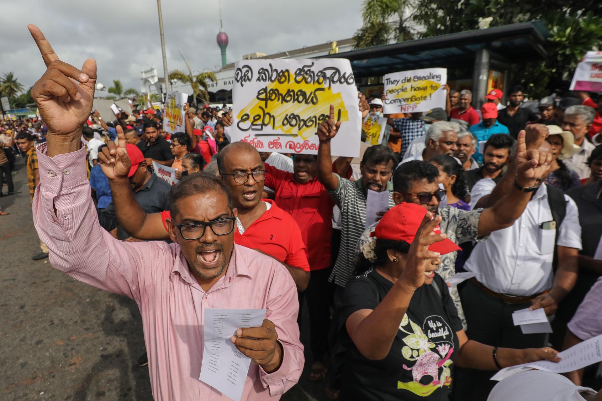Supporters of Sri Lanka's National People's Power (NPP) political alliance shout slogans during a protest accusing the government of trying to cripple the Employees' Provident Funds under the guise of the domestic debt restructuring process in Colombo, Sri Lanka, 31 July 2023. EFE-EPA/CHAMILA KARUNARATHNE