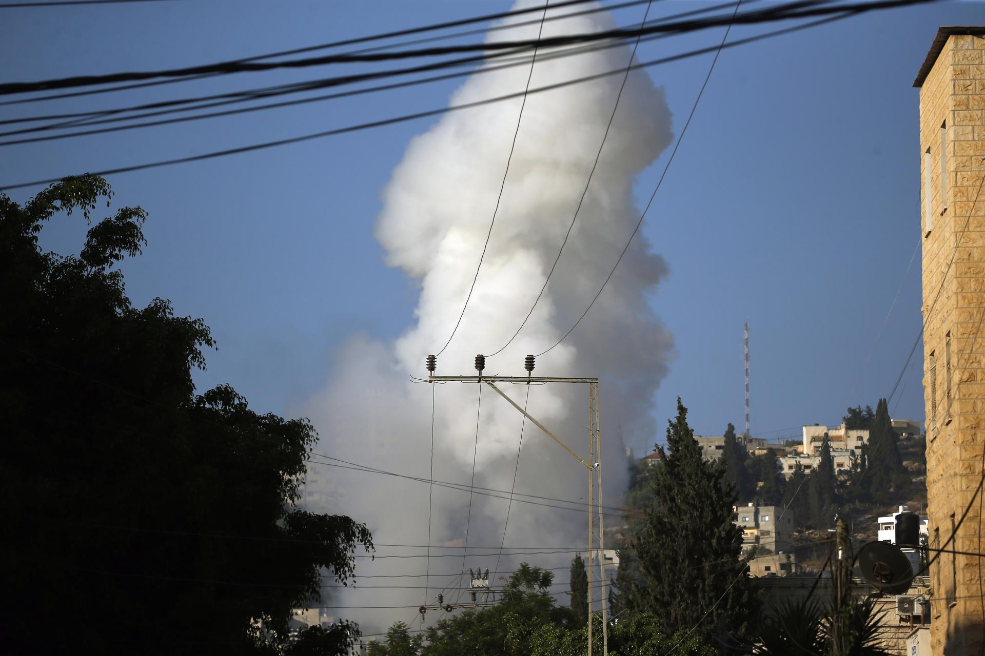 Smoke rises as the Israeli military conducts air raids in Jenin, the West Bank, 03 July 2023. EFE-EPA/ALAA BADARNEH