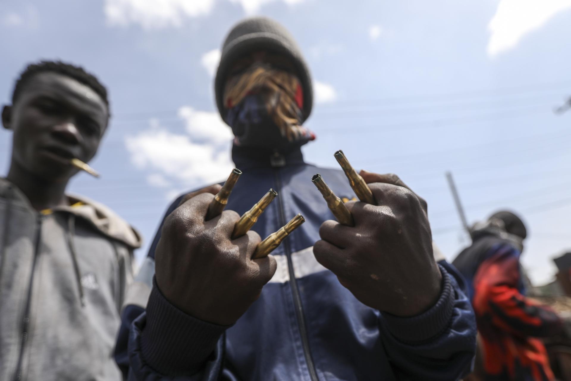 Protesters and supporters of the opposition Azimio coalition hold used bullets used by police as they engage with riot police in running battles, during the second day of renewed nationwide protests in Nairobi, Kenya, 20 July 2023. EFE/EPA/Daniel Irungu
