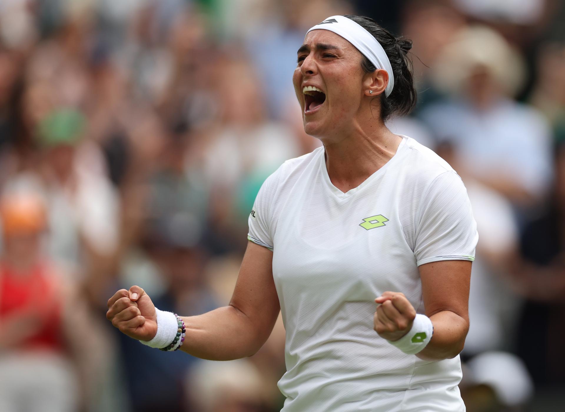Sixth-seeded Tunisian Ons Jabeur celebrates after defeating Kazakhstan's Elena Rybakina 6-7 (5-7), 6-4, 6-1 in women's singles quarterfinal action at Wimbledon on 12 July 2023 in London, United Kingdom. EFE/EPA/ISABEL INFANTES

