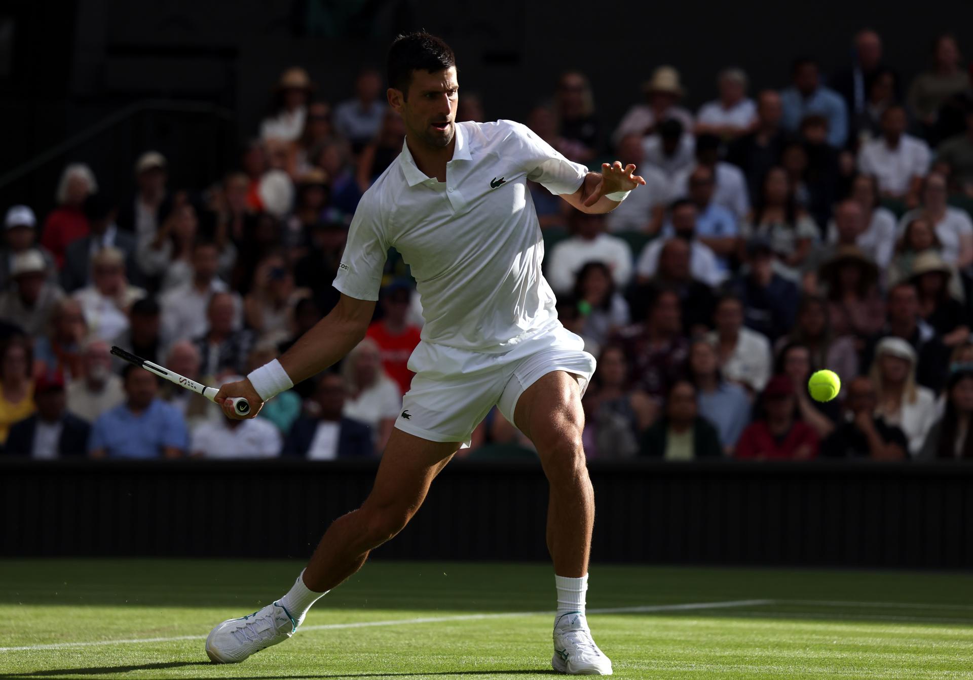 Novak Djokovic of Serbia prepares to hit a forehand during his second-round match against Jordan Thompson of Australia at the Wimbledon Championships, Wimbledon, Britain, on 5 July 2023. Djokovic won 6-3, 7-6 (7-4), 7-5. EFE/EPA/NEIL HALL EDITORIAL USE ONLY
