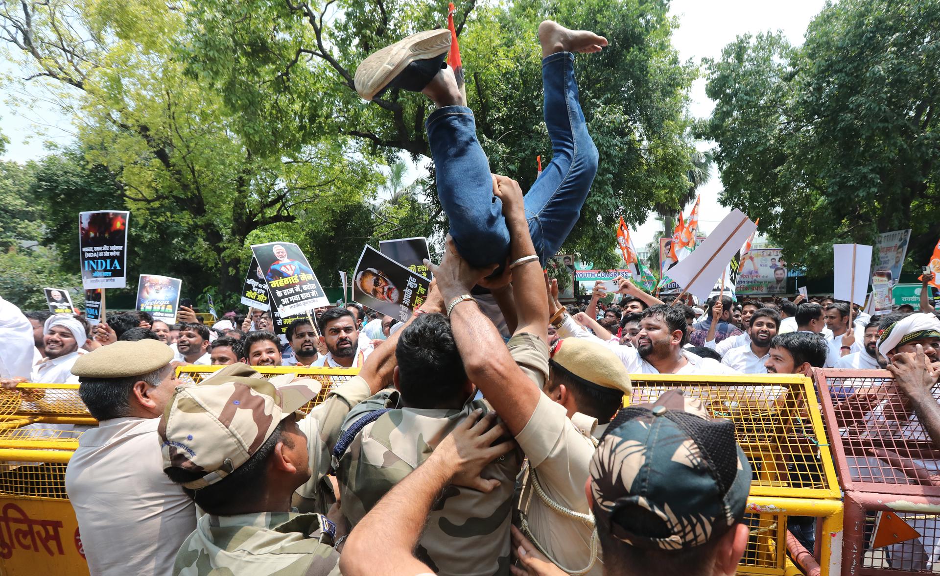 An Indian Youth Congress worker is detained by police at a protest against the ongoing violence in Manipur state in New Delhi, India 20 July 2023. EFE/EPA/HARISH TYAGI