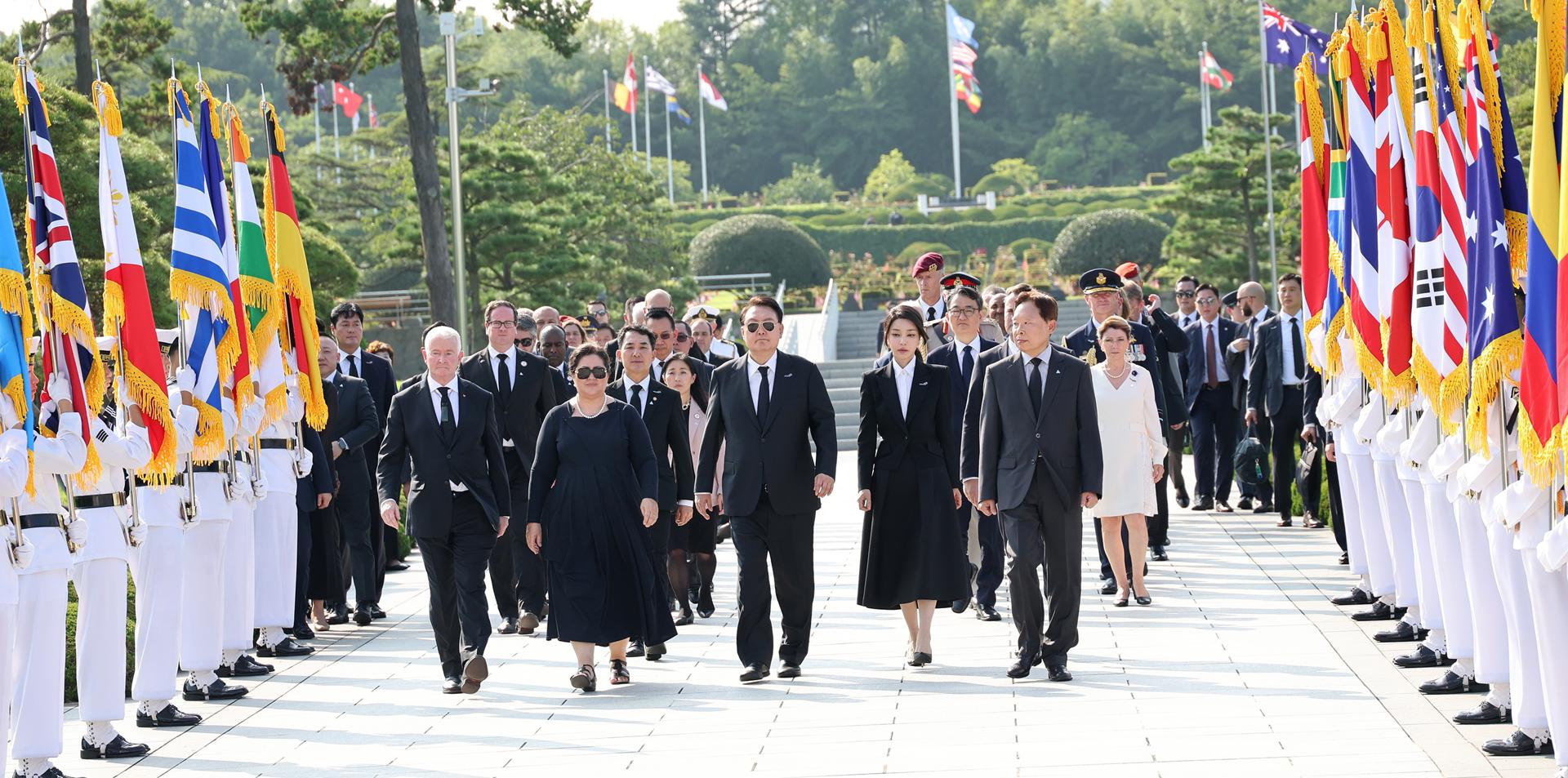 South Korea's President Yoon Suk Yeol (C, front) and his wife, Kim Keon Hee (2-R, front), visit the U.N. Memorial Park in Busan, 320 kilometers southeast of Seoul, South Korea, 27 July 2023, during the 70th anniversary of the Korean War armistice agreement. EFE/EPA/YONHAP SOUTH KOREA OUT