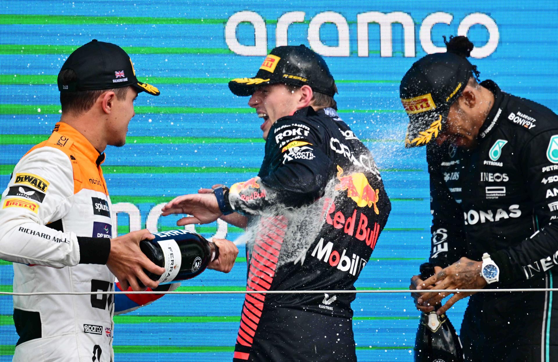 Race winner Max Verstappen (C), second-place finisher Lando Norris (L) and third-place finisher Lewis Hamilton celebrate on the podium after the Formula One Grand Prix of Great Britain at the Silverstone Circuit in Silverstone, England, on 9 July 2023. EFE/EPA/CHRISTIAN BRUNA