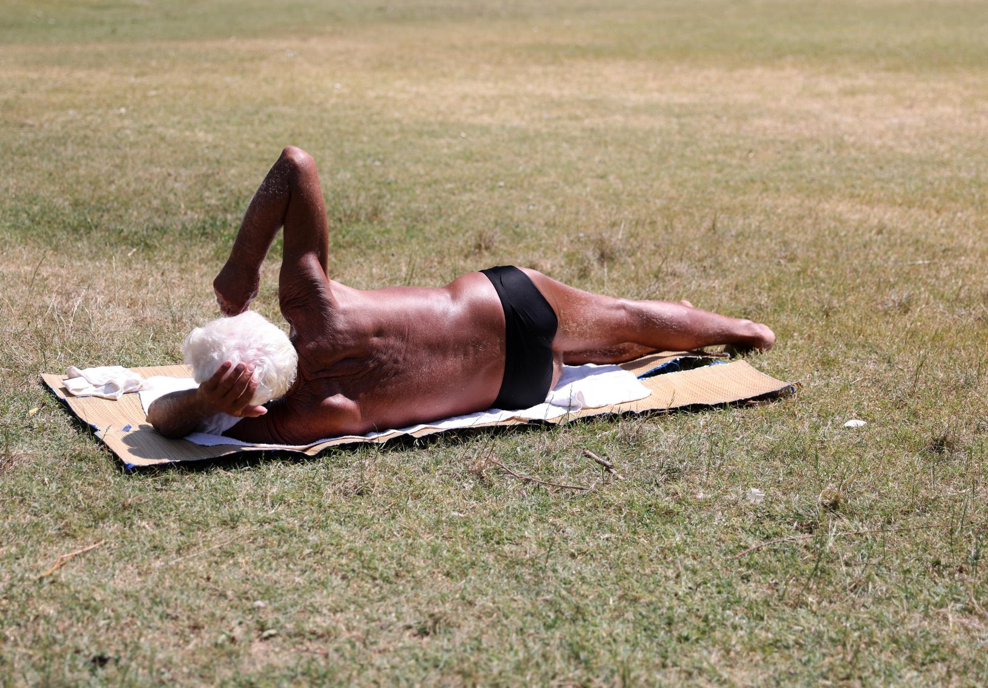 A man sunbathes at the Lido beach on the river Danube in Belgrade, Serbia, 17 July 2023.  EFE/EPA/ANDREJ CUKIC
