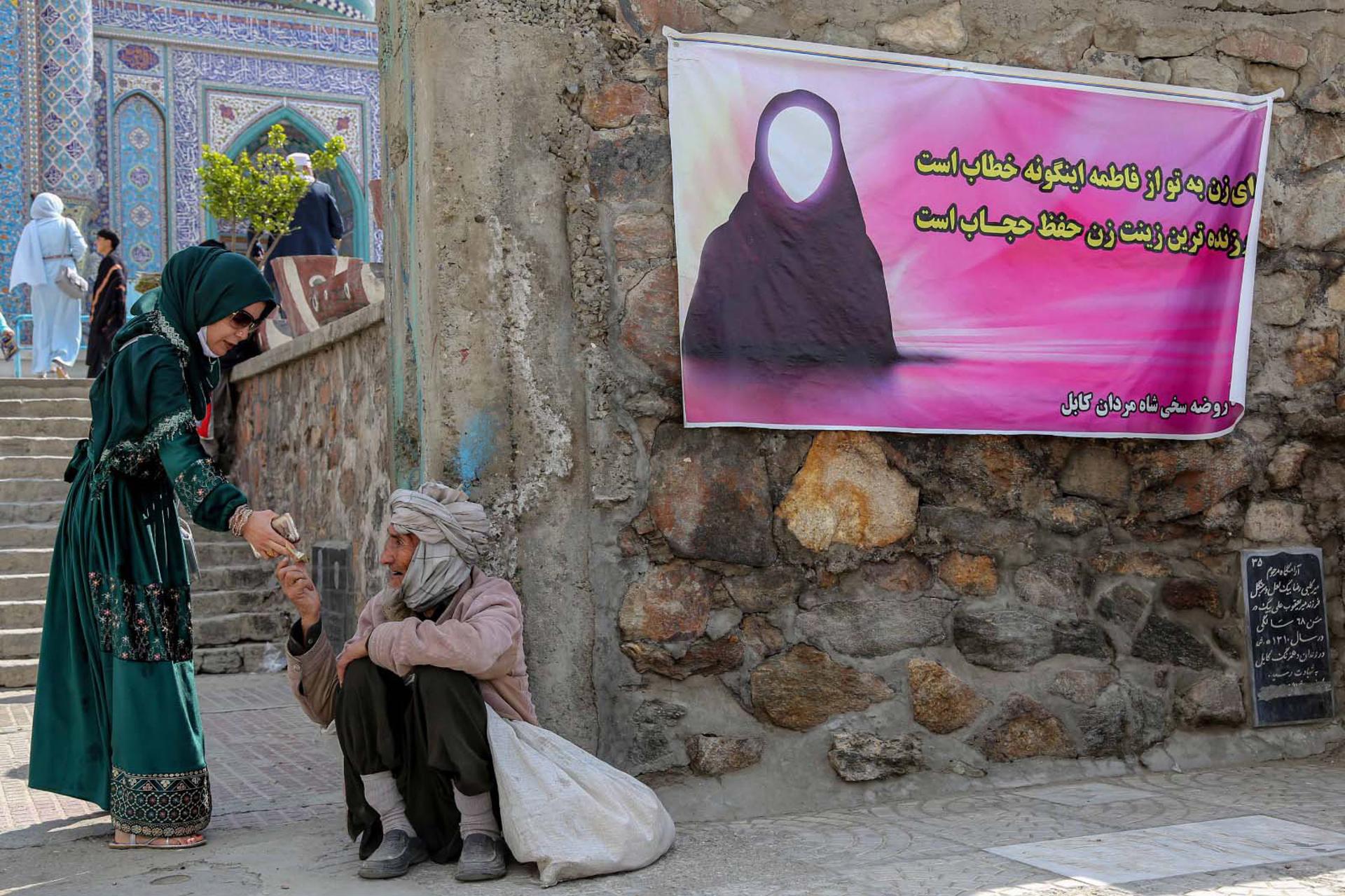 A banner reading in Dari 'O women, you will be addressed by Fatimah, the most beautiful woman is the one who is protective of her hijab' during celebrations of Persian new year in Kabul, Afghanistan, 21 March 2023. EFE-EPA FILE/SAMIULLAH POPAL