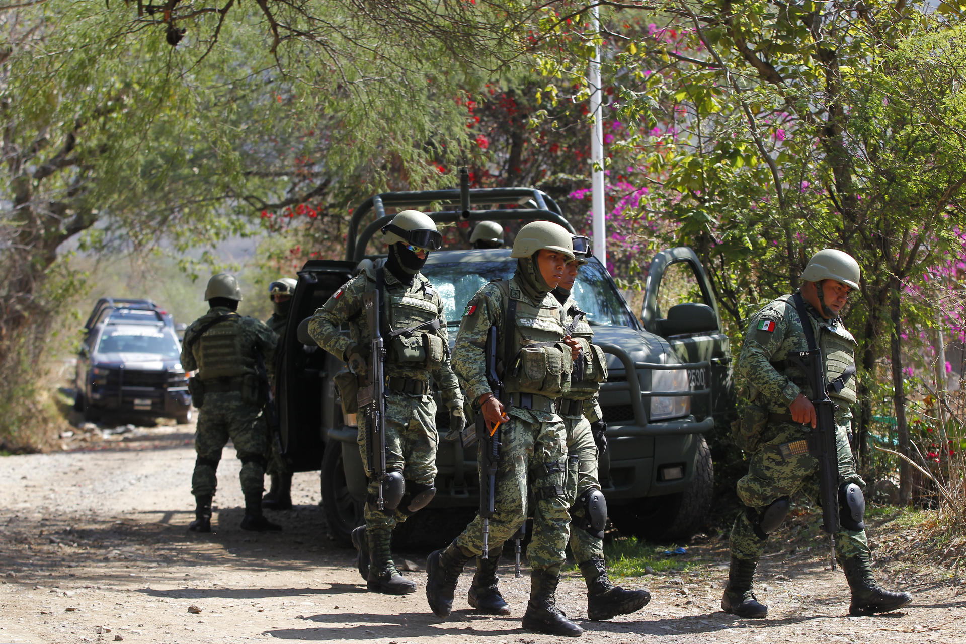 Soldiers help secure the crime scene in Tlajomulco, Mexico, on 12 July 2023, following an attack with explosives that left six police dead and 12 wounded. EFE/Francisco Guasco
