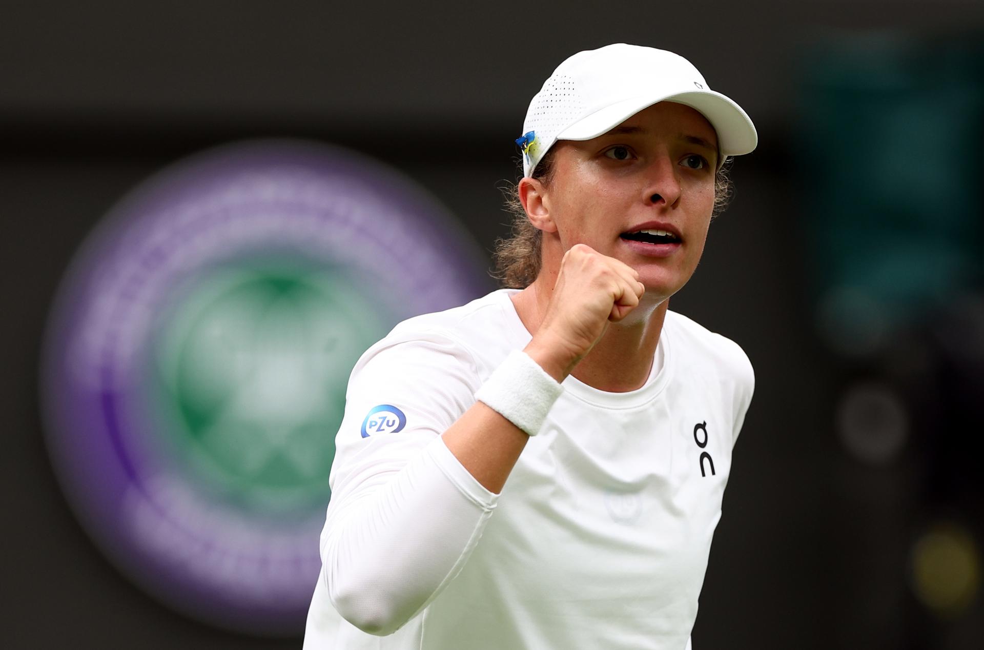 Iga Swiatek of Poland celebrates after defeating Lin Zhu of China 6-1, 6-3 in first-round action at the Wimbledon Championships, Wimbledon, Britain, 3 July 2023. EFE/EPA/ADAM VAUGHAN/EDITORIAL USE ONLY