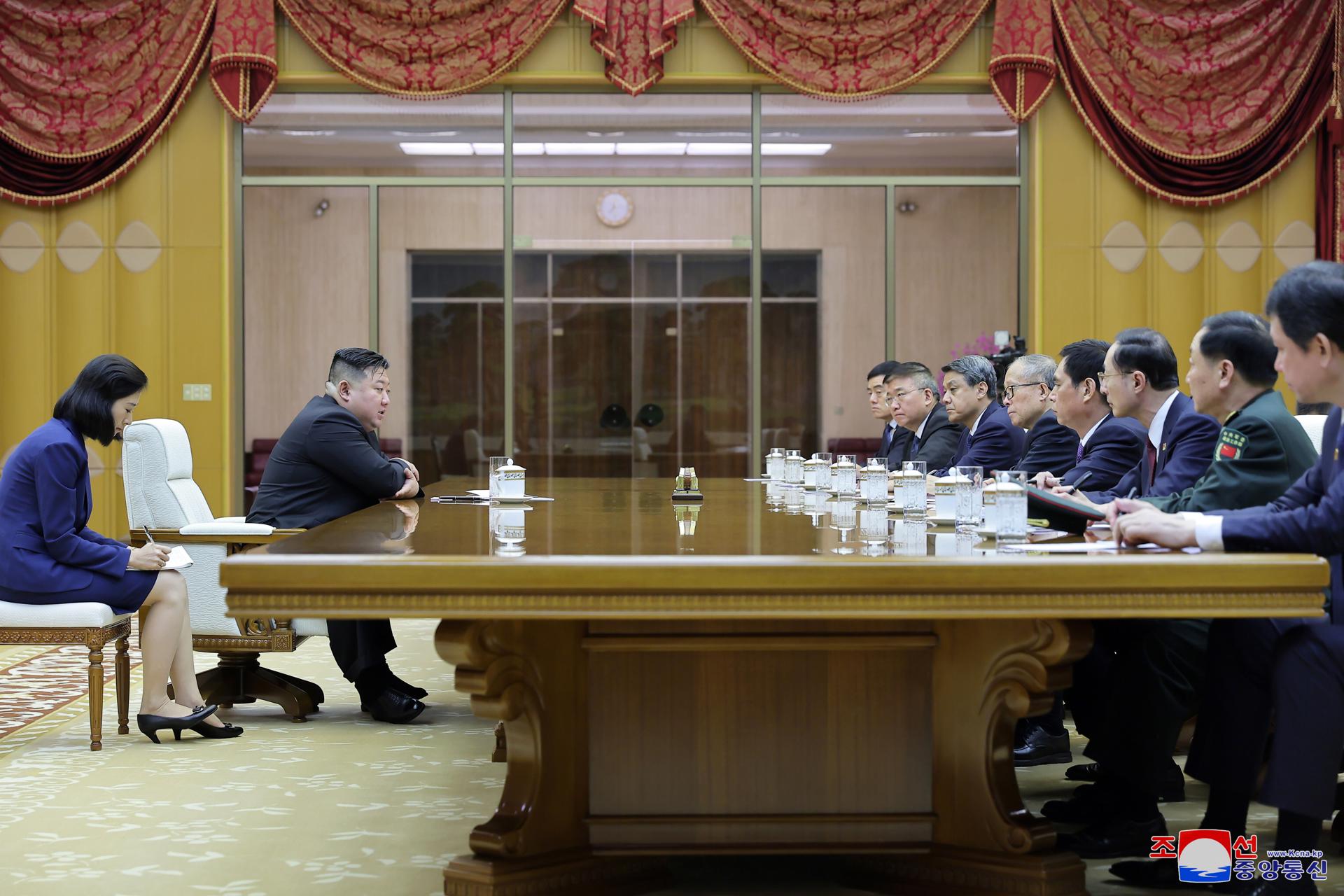A photo released by the official North Korean Central News Agency (KCNA) on 29 July 2023, shows North Korean leader Kim Jong Un (L) during a meeting with a Chinese delegation led by Li Hongzhong (5-R), member of the Political Bureau of the Central Committee of the Communist Party of China, in Pyongyang, North Korea, July 28, 2023. EFE/EPA/KCNA EDITORIAL USE ONLY