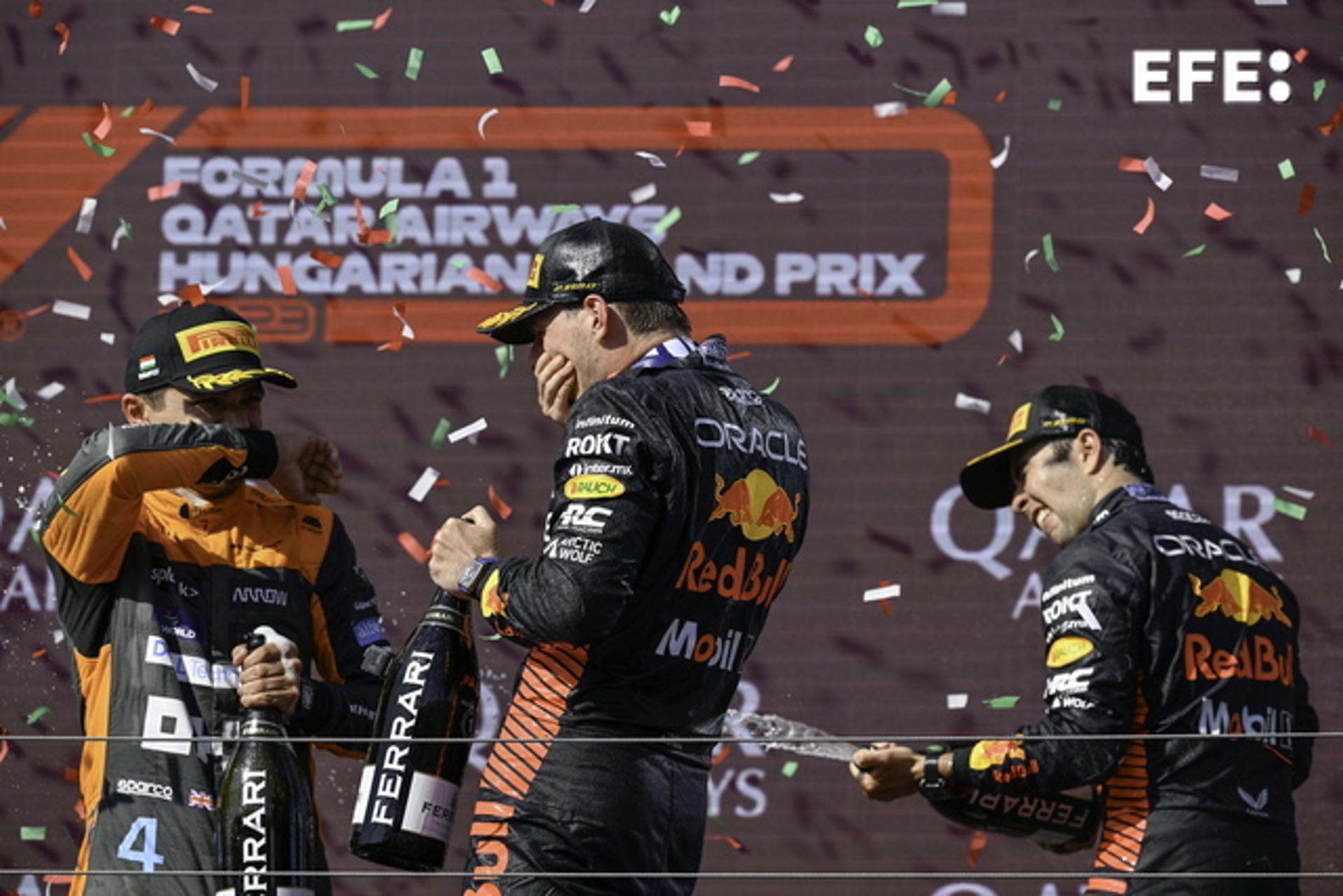 Winner Max Verstappen (C), second-place Lando Norris of Britain (L) and third-place Sergio "Checo" Perez celebrate on the podium after the Formula One Hungarian Grand Prix at the Hungaroring in Mogyorod, Hungary, on 23 July 2023. EFE/EPA/Zsolt Czegledi HUNGARY OUT
