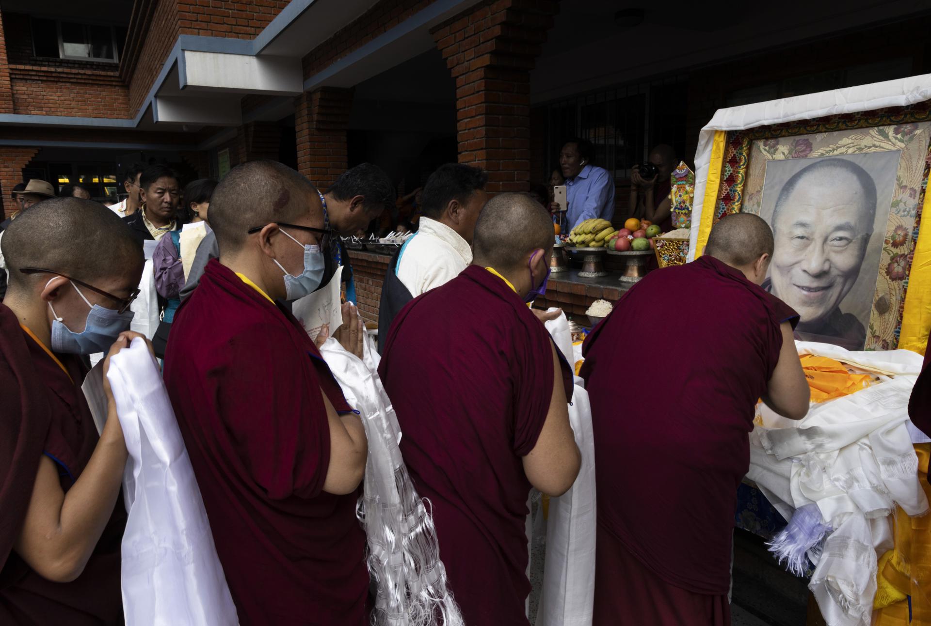 Exiled Tibetans offer Khatta in front of a portrait of their spritual leader, the Dalai Lama, during an event to mark his 88th birthday at the Namgel School premises, in Kathmandu, Nepal, 06 July 2023. EFE-EPA/NARENDRA SHRESTHA ATTENTION: This Image is part of a PHOTO SET
