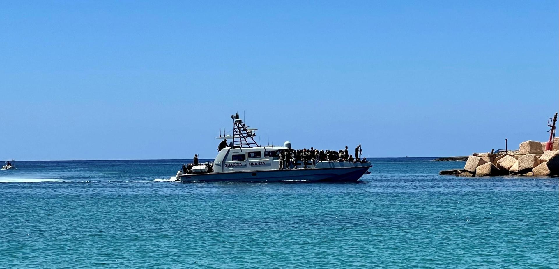 A patrol boat of the Italian Financial Guard enters the port with migrants onboard, in Lampedusa, near Agrigento, Italy, 10 August 2023. EFE-EPA/ELIO DESIDERIO