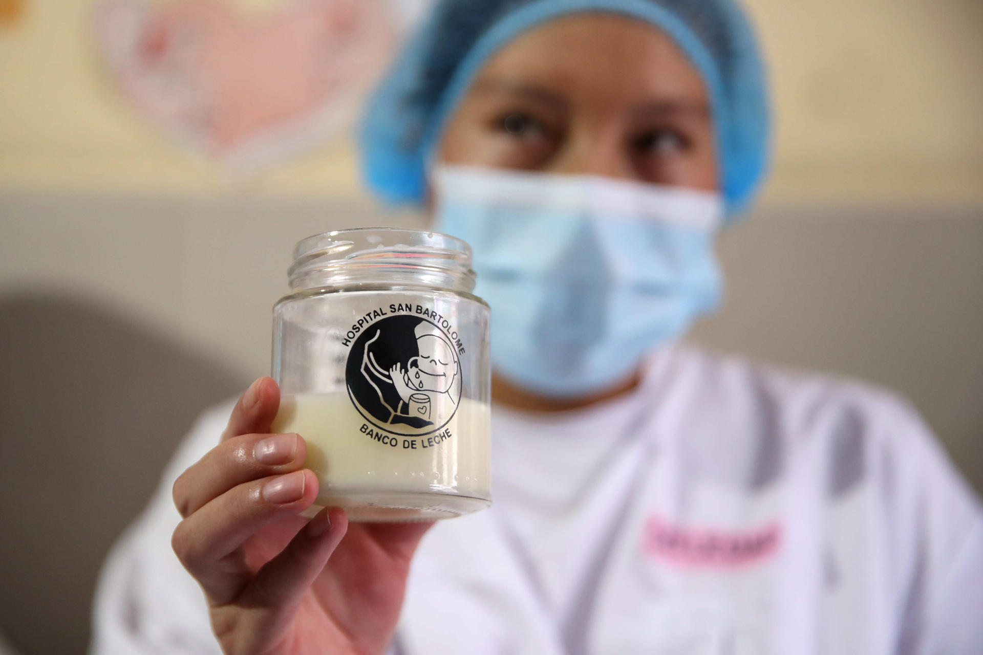 A mother shows a container with breast milk, today, during a breast milk extraction marathon to donate to premature babies, at the San Bartolomé hospital, in Lima, Peru, 21 August 2023. EFE/ Paolo Aguilar
