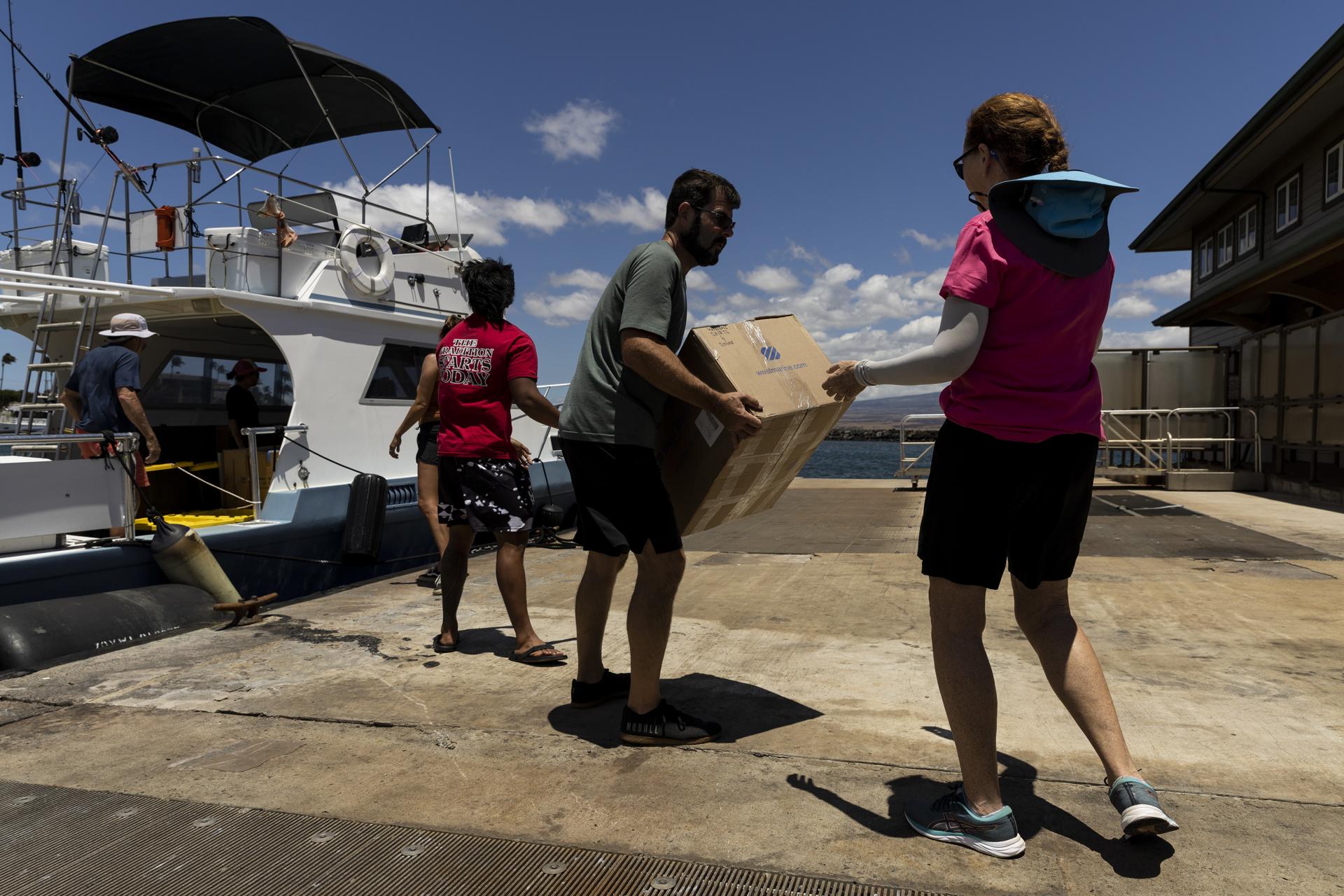 A boat bringing donations from Ohau is unloaded before being loaded on trucks to Lahaina at the port of Maalaea, Hawaii, USA, 13 August 2023. EFE-EPA/ETIENNE LAURENT/FILE
