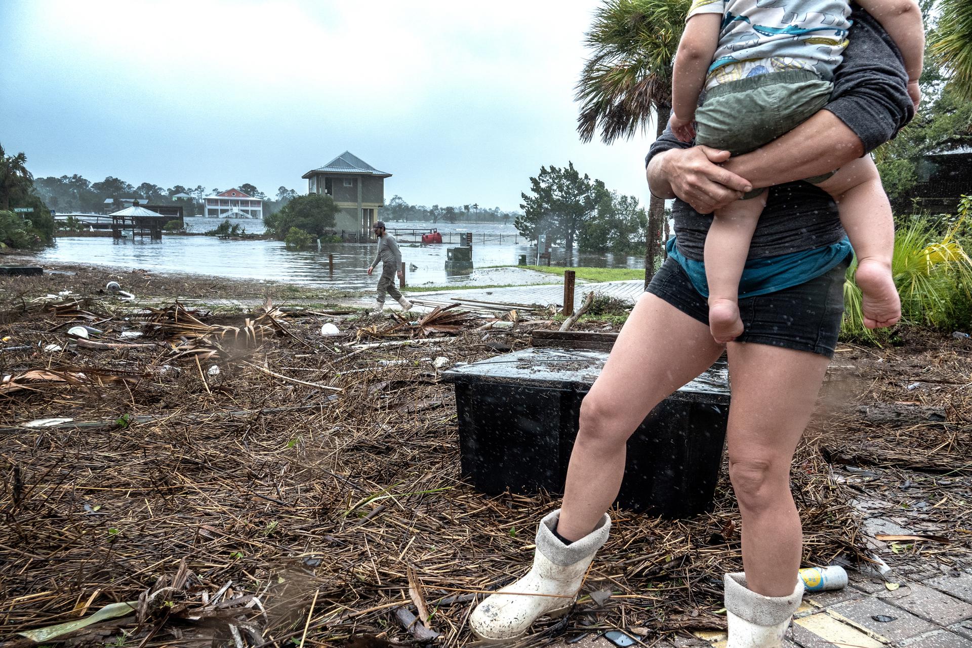 A family checks their belongings in the town of Jena after Hurricane Idalia made landfall near Keaton Beach, Florida, USA, 30 August 2023. EFE/EPA/CRISTOBAL HERRERA-ULASHKEVICH

