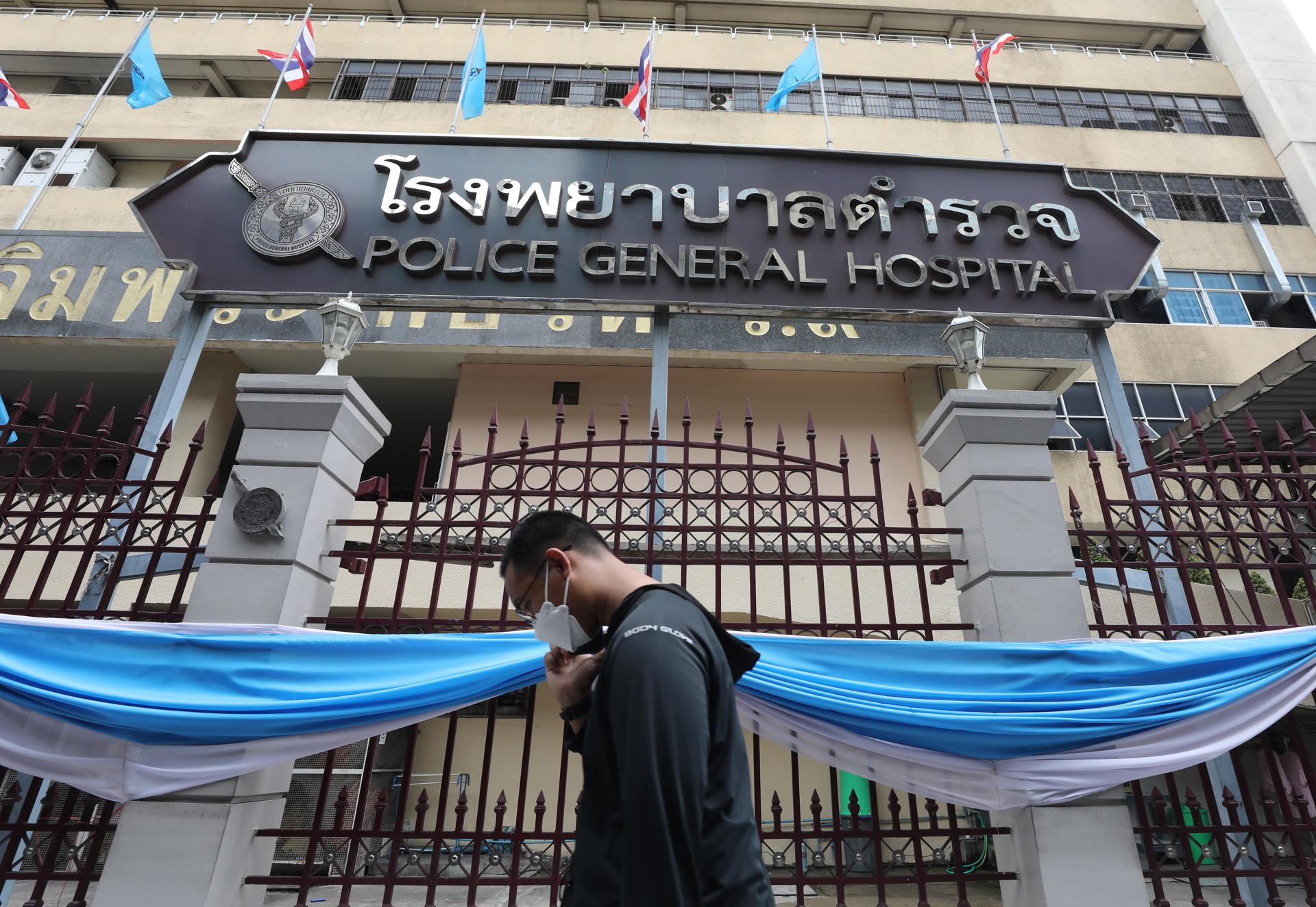 A Thai man walks past the Police General Hospital, where former Thai Prime Minister Thaksin Shinawatra was transferred, in Bangkok, Thailand, 23 August 2023. EFE-EPA/NARONG SANGNAK