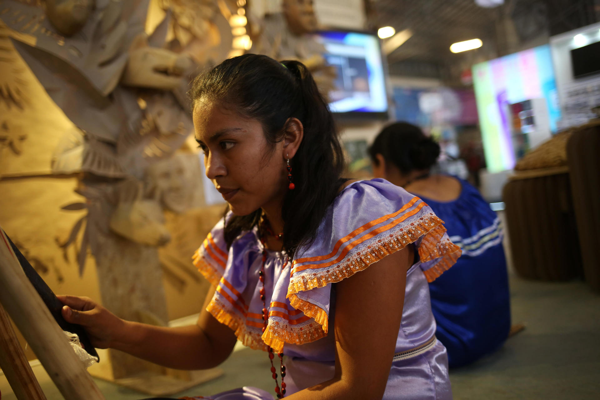 Tacana indigenous women demonstrate their traditional weaving technique at the International Book Fair in La Paz on 9 August 2023. EFE/Luis Gandarillas
