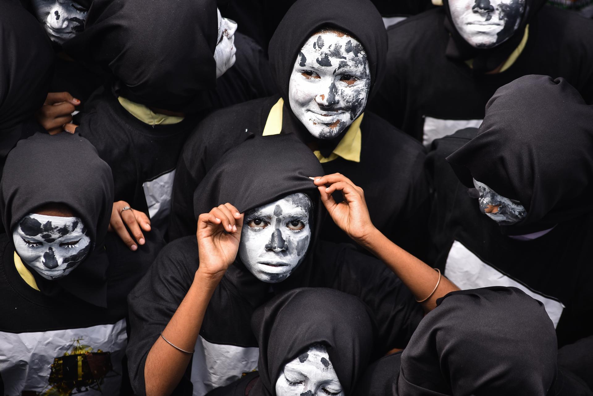 Indian students with their faces painted as the moon gather to celebrate the Indian Space Research Organisation's (ISRO) mission of Chandrayaan-3's first attempt to land on the moon, in Chennai, India, 22 August 2023. EFE-EPA/IDREES MOHAMMED
