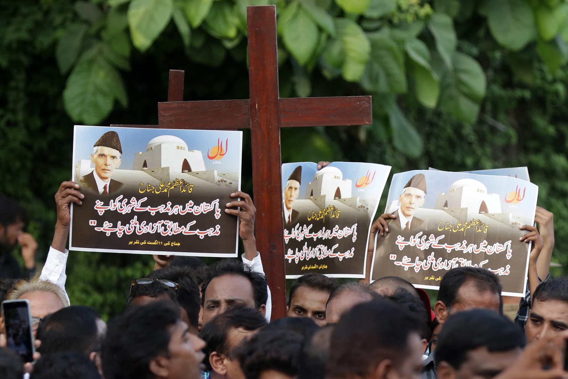 Members of the Christian minority hols placards showing picture of founder of Pakistan, Muhammad Ali Jinnah quoting him in Urdu 'Pakistani citizen of any religion should have freedom to practice their own religion' as they shout slogans during a protest against mob attacks that erupted the day before in Jaranwala, near Faisalabad, in Peshawar, Pakistan, 17 August 2023. EFE-EPA/RAHAT DAR