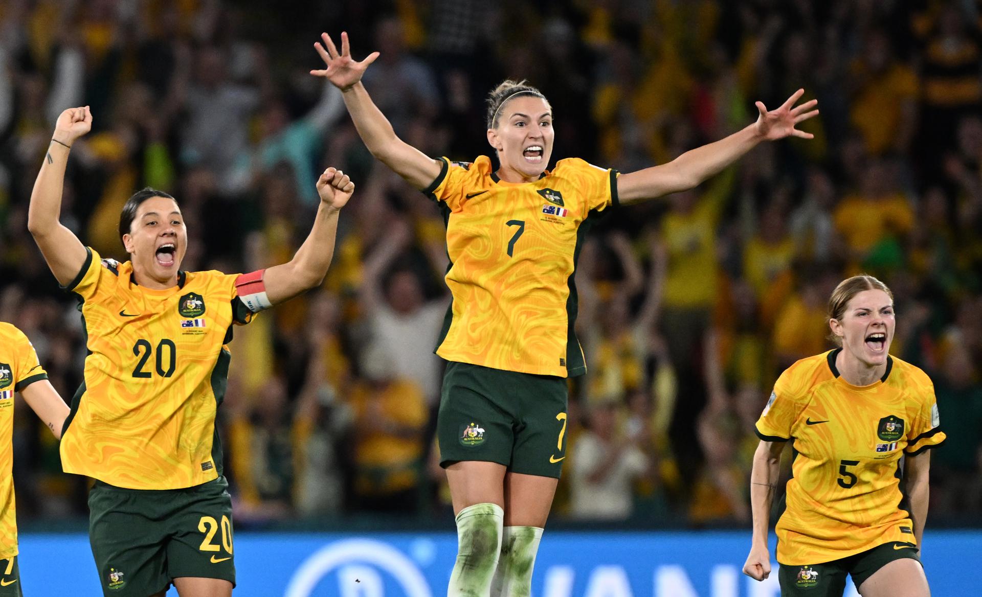 Sam Kerr (left), Steph Catley (center) and Cortnee Vine of Australia react after the Matildas defeated France in a penalty shoot-out in a FIFA Women's World Cup 2023 quarterfinal contest in Brisbane, Australia, on 12 August 2023. EFE/EPA/DARREN ENGLAND AUSTRALIA AND NEW ZEALAND OUT
