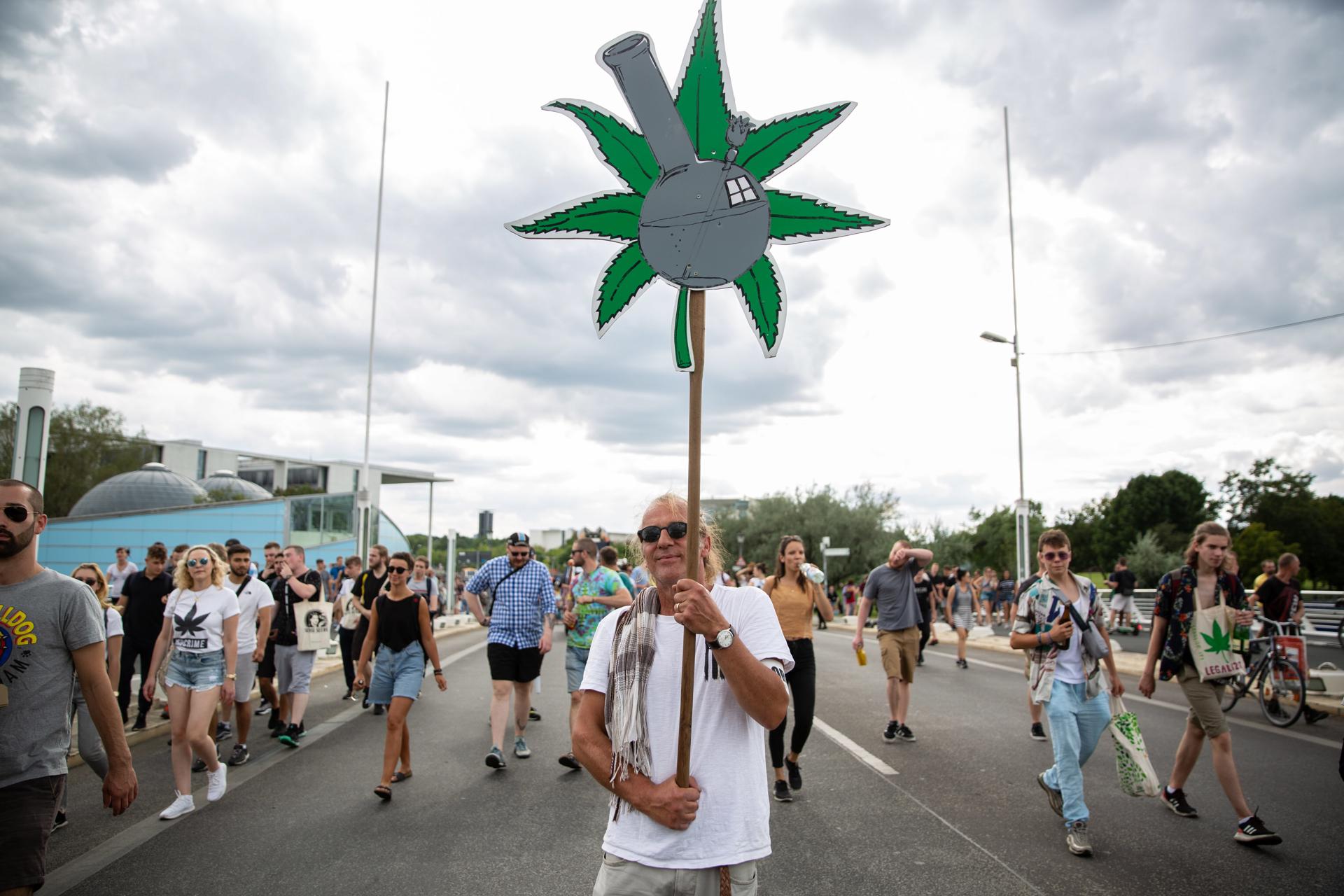 (FILE) A participant holds a banner with the cannabis symbol during the Hemp Parade (Hanfparade) demonstration as they pass by the Federal Chancellery in Berlin, Germany, 10 August 2019. EFE/EPA/OMER MESSINGER