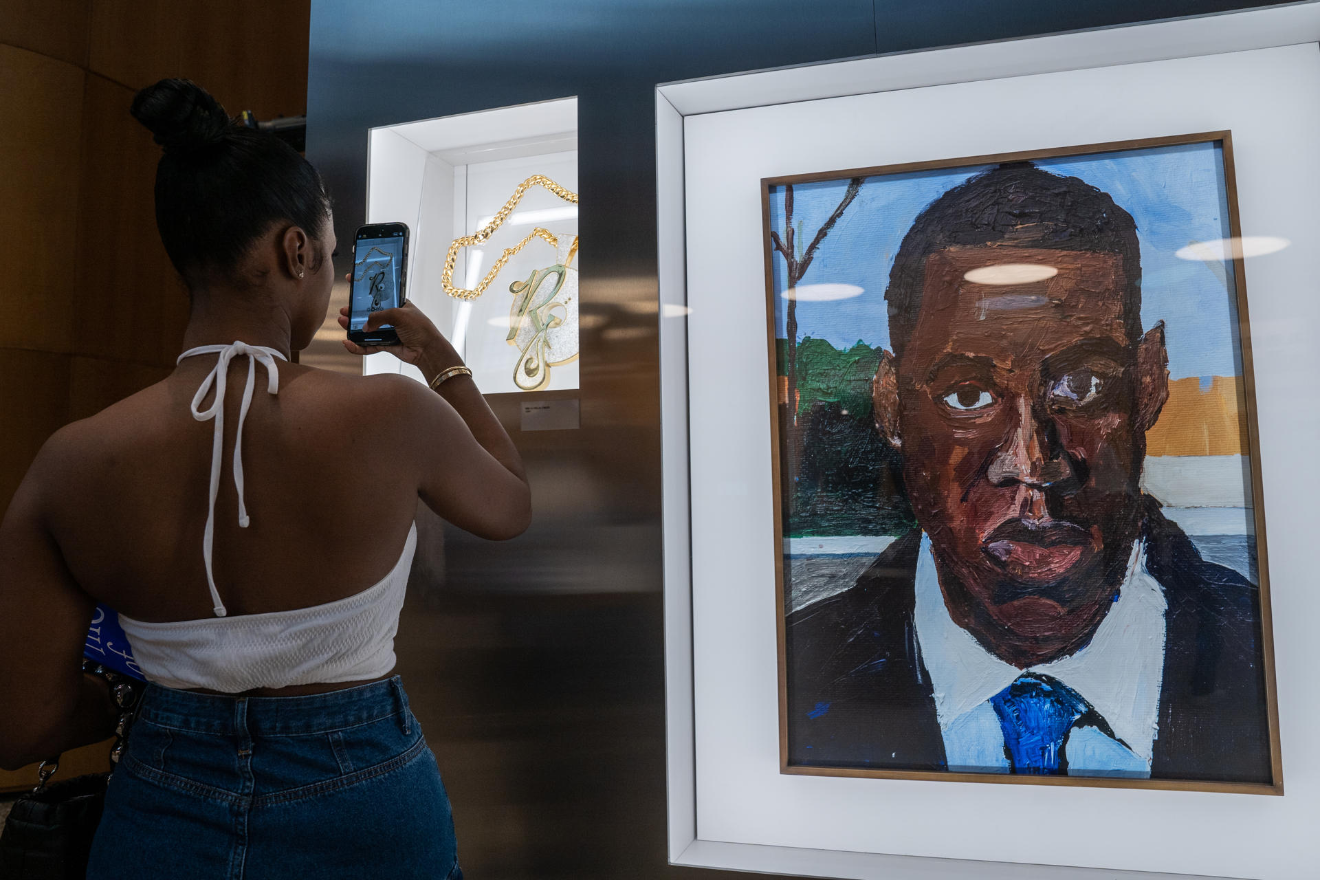 Several people visit an exhibit on the life of hip-hop legend Jay-Z titled "The Book of Hov" on 8 August 2023 in Brooklyn (USA). EFE/ Ángel Colmenares