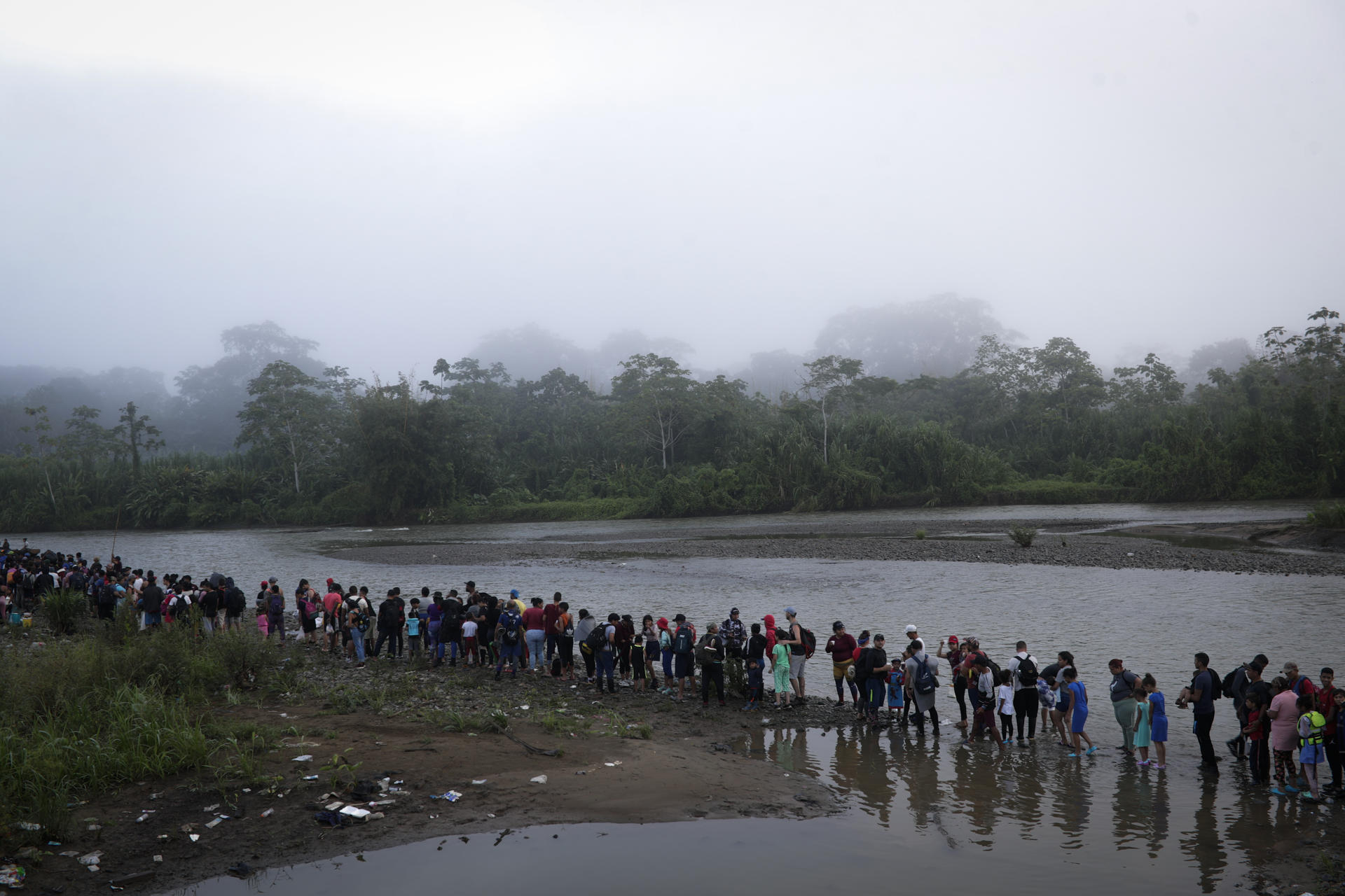 Thousands of migrants line up upon arrival in the town of Bajo Chiquito to be sent to a migration reception station (ERM) in San Vicente after crossing the Darien jungle during their migration to the United States, in Bajo Chiquito, Panama, 14 October 2022. EFE-EPA FILE/Bienvenido Velasco