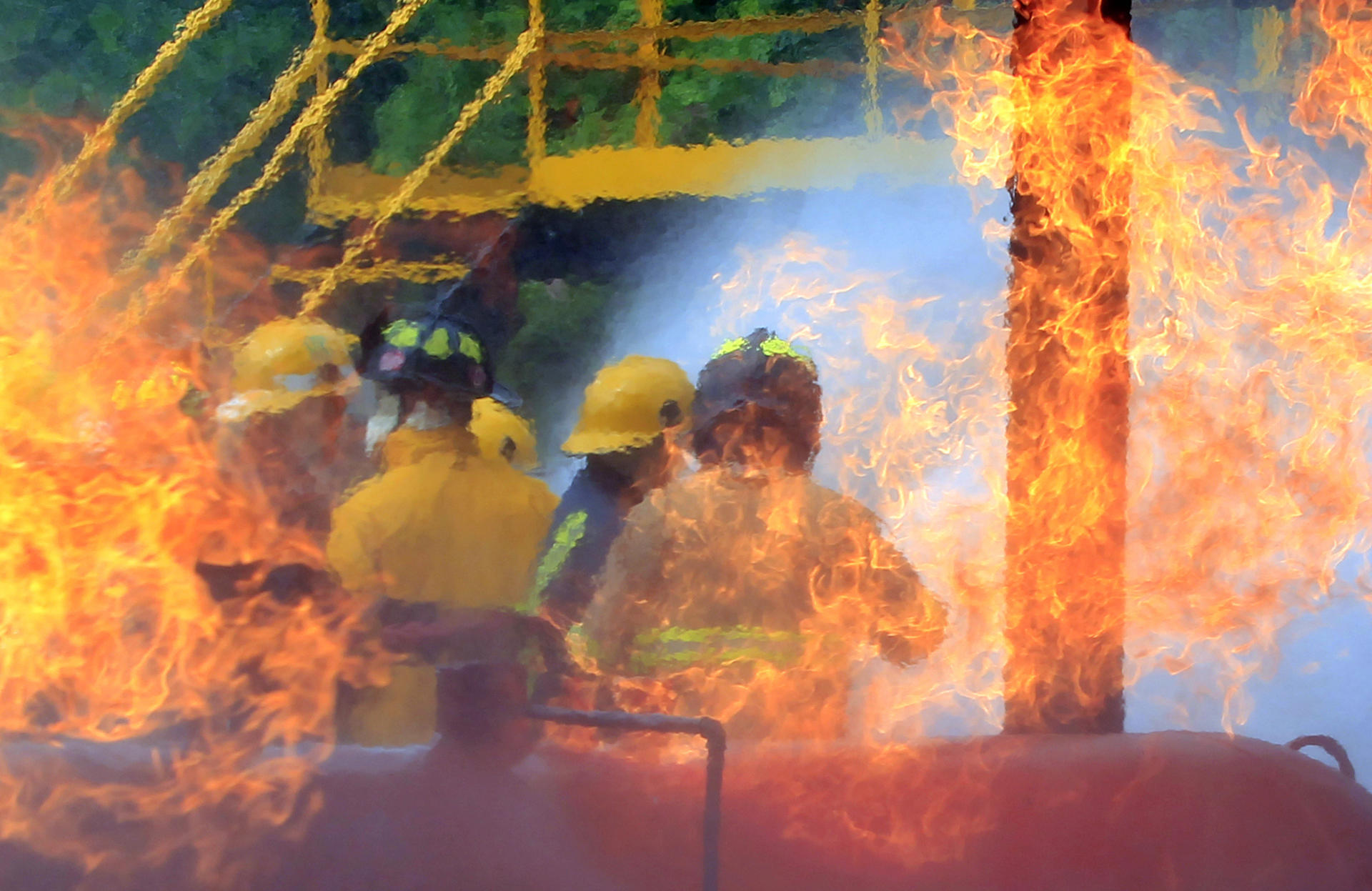 A 10 August 2023 photo of firefighters from different Latin American countries preparing for various types of emergencies at a training course in Cartagena (Colombia). EFE/Ricardo Maldonado Rozo
