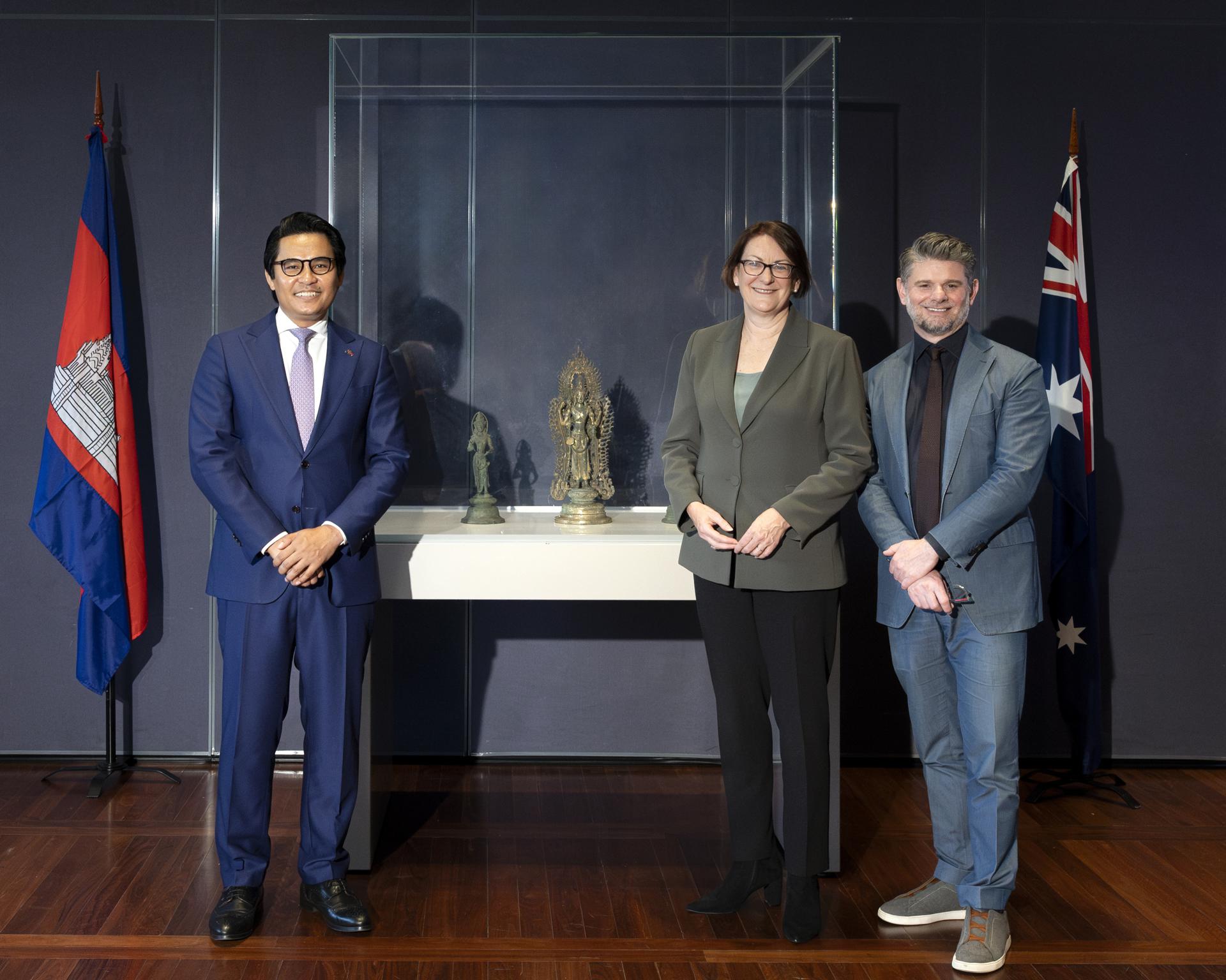 A handout photo shows (L-R) Ambassador HE Dr Cheunboran Chanborey, Director Nick Mitzevich, and Ms Susan Templeman MP pictured with 'Bodhisattva Avalokiteshvara with attendants' at the National Gallery of Australia, Kamberri/Canberra, 2023. EFE/HANDOUT/Karlee Holland/National Gallery of Australia
