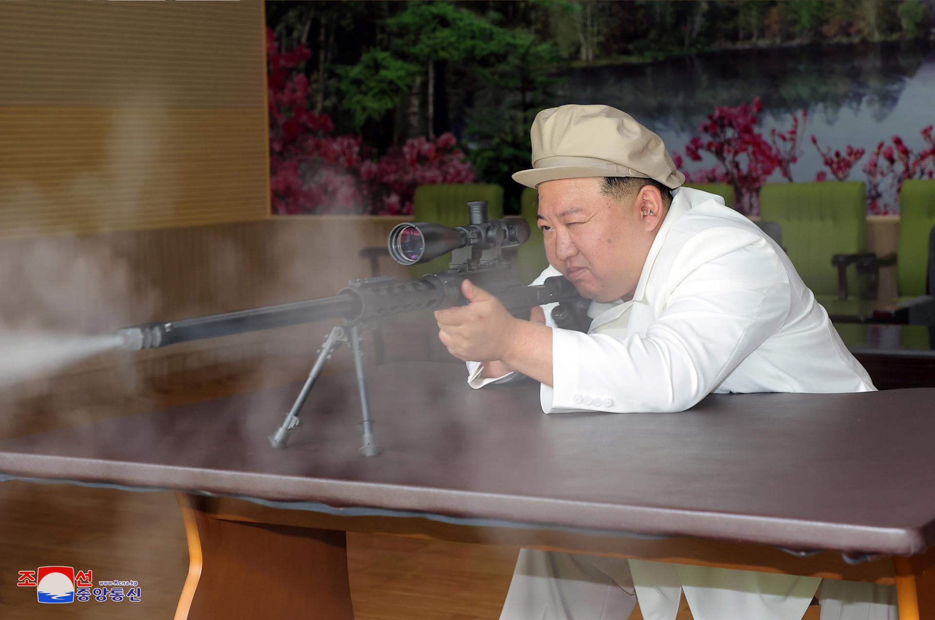 An undated photo released by the official North Korean Central News Agency (KCNA) on 06 August 2023 shows North Korean leader Kim Jong-un trying a weapon during an inspection of major munitions factories at an undisclosed location in North Korea. EFE-EPA FILE/KCNA EDITORIAL USE ONLY