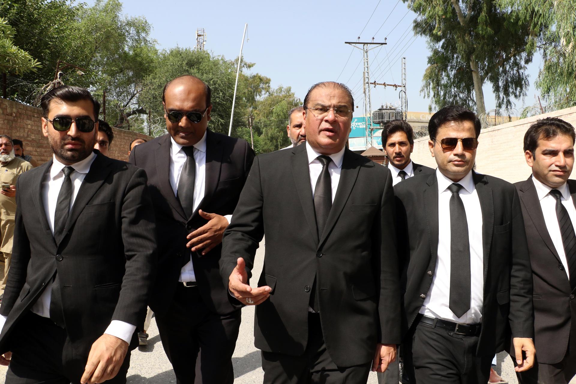 Intezar Panjutha (2-L), Naeem Panjutha (2-R) and other members of the legal team of Imran Khan, the former prime minister and chairman of Pakistan Tehrik-e-Insaf (PTI) political party, arrive to attend a hearing at a prison, in Attock, Pakistan, 30 August 2023. EFE-EPA/SOHAIL SHAHZAD
