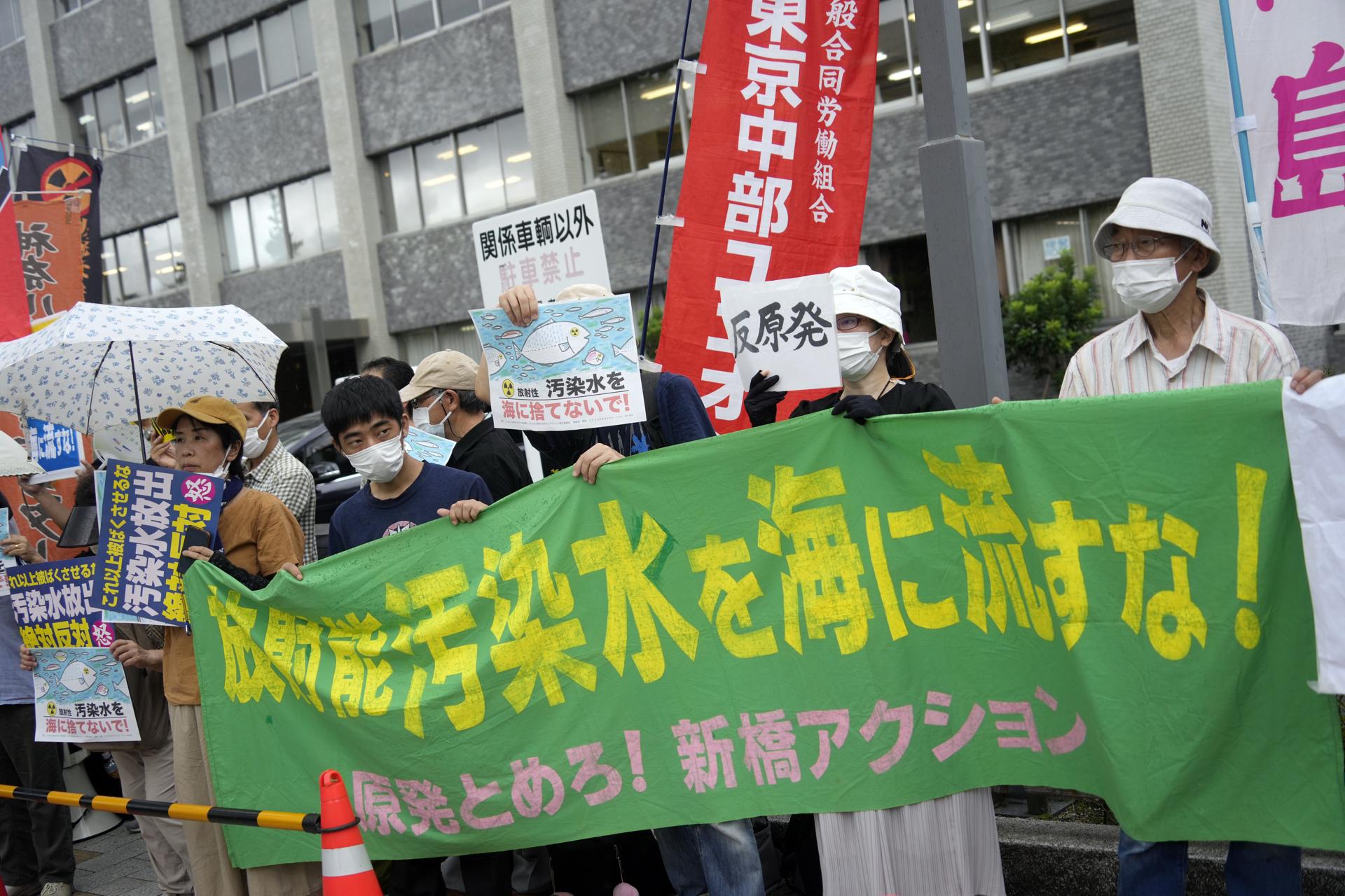 Protesters hold banners reading 'Don't discharge contaminated water into the sea!' during a rally in front of the Prime Minister's official residence as Prime Minister Fumio Kishida was holding a ministerial meeting about the release of treated water from the crippled Fukushima nuclear power plant into the sea, in Tokyo, Japan, 22 August 2023. EFE-EPA/FRANCK ROBICHON
